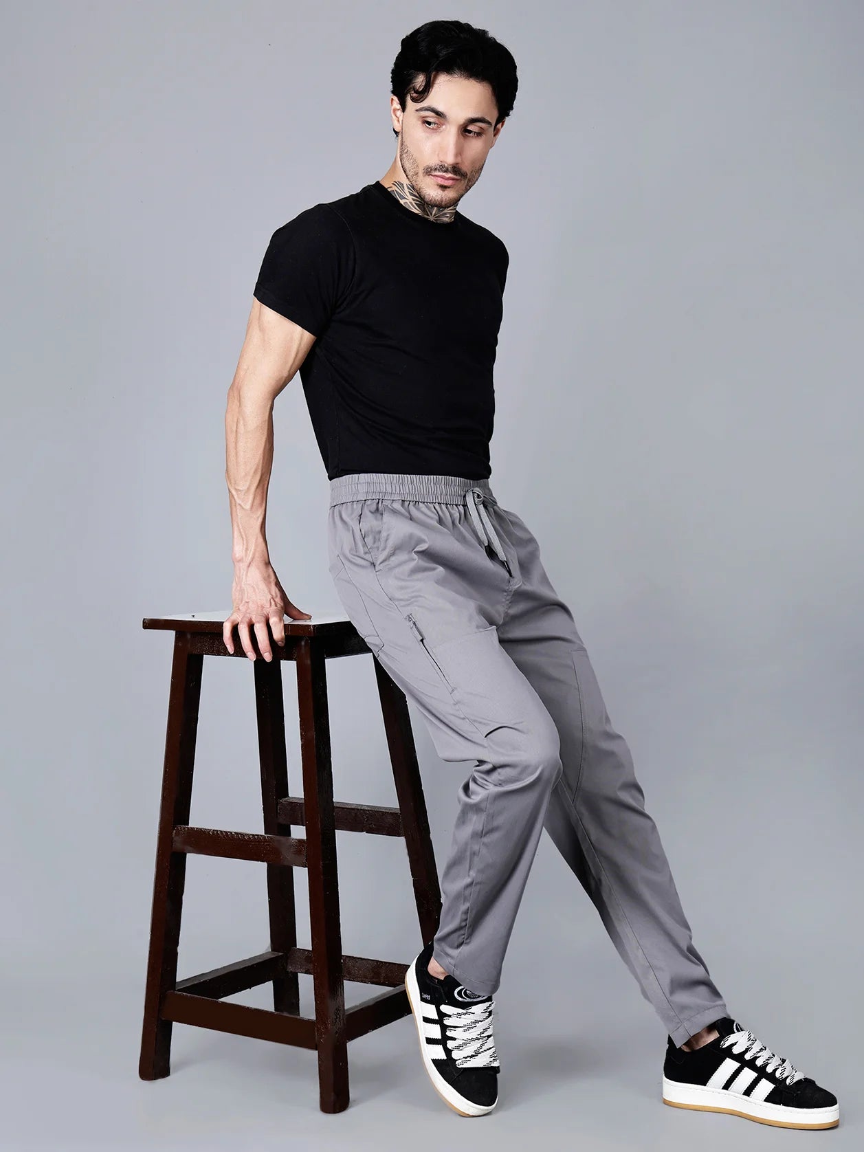 Discover the perfect balance of comfort, style, and functionality for everyday wear or workouts with the Fort Collins Grey Slim Fit Cargo Track Pant for Men, featuring a zippered side pocket. Shop now for this fashionable, versatile choice from anywhere in India.