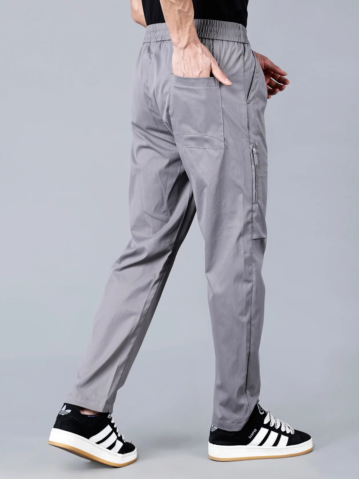 The Fort Collins Grey Cargo Track Pants for Men feature a zippered side pocket, offering a perfect balance of comfort, style, and functionality for daily use or workouts. This fashionable piece available for online shopping in India.