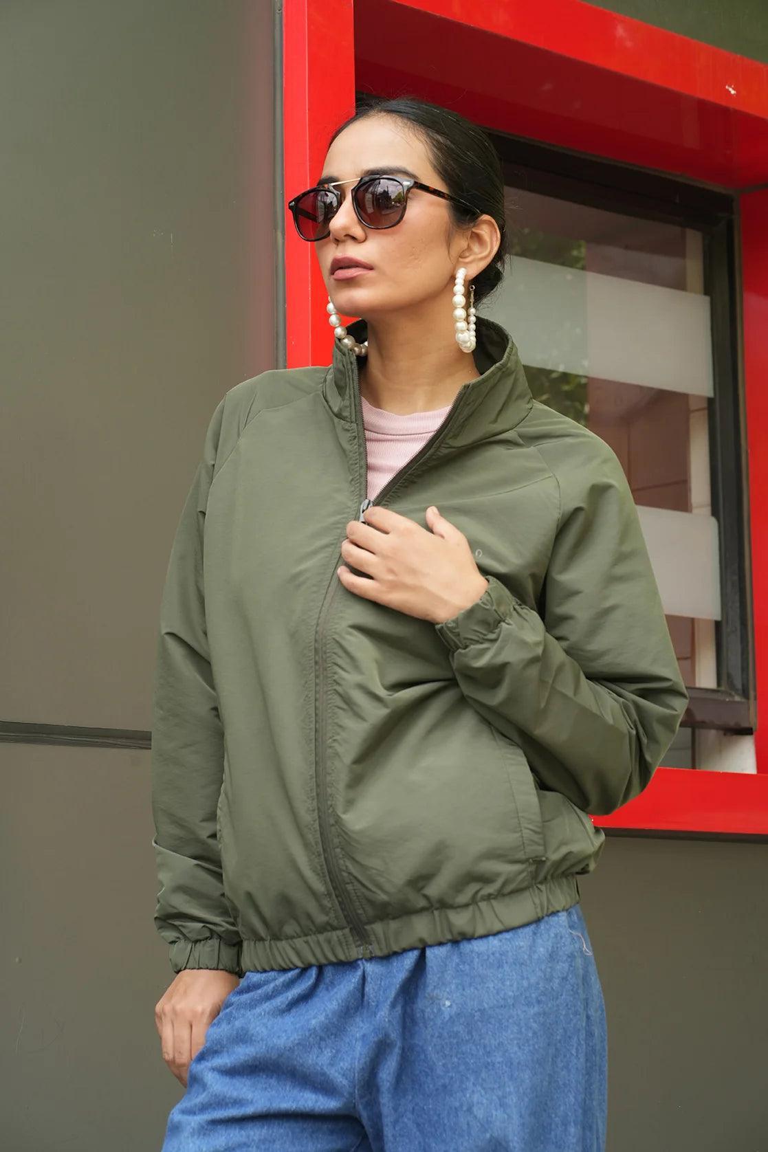 Upgrade your wardrobe with the Fort Collins Women's Green Windbreaker Jacket, equipped with a mesh-net lining for added comfort. Shop online from anywhere in India for this stylish piece.