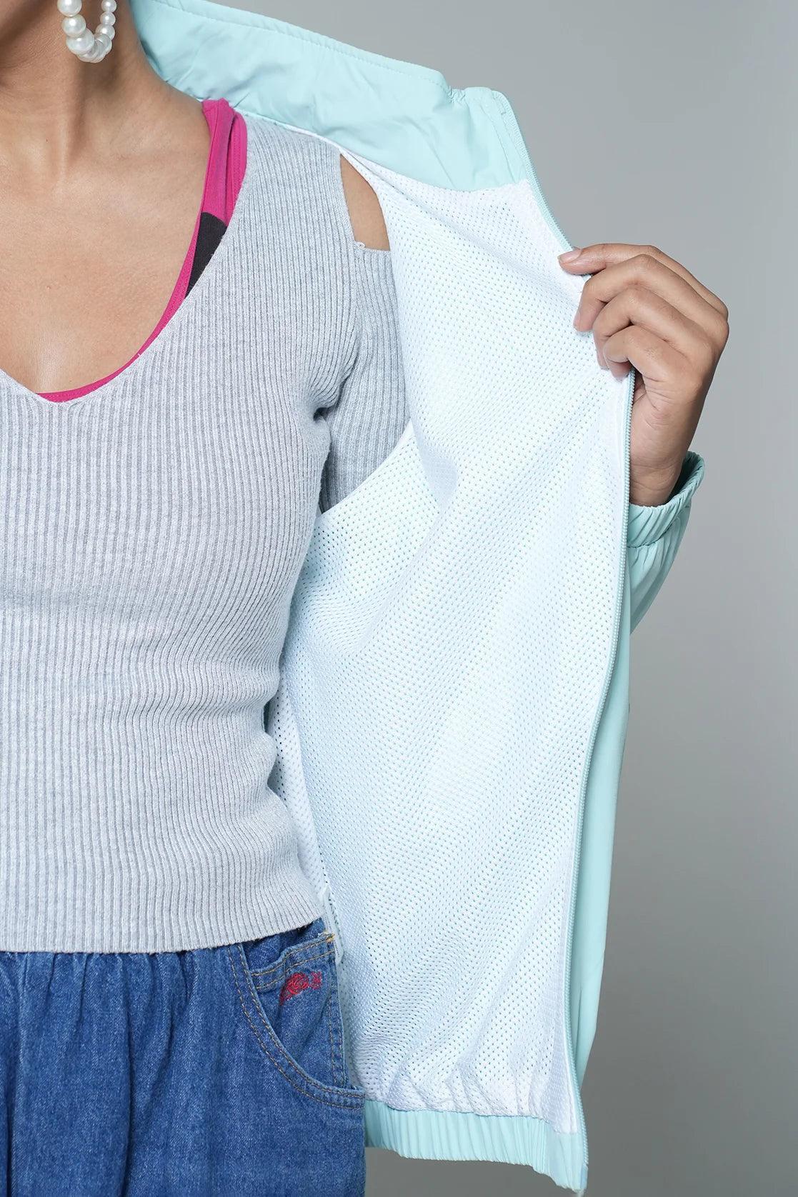 Experience a stylish upgrade to your wardrobe with Fort Collins' Women's Sky Blue Windbreaker Jacket, featuring a sleek mesh-net lining. Available for online purchase from anywhere in India.