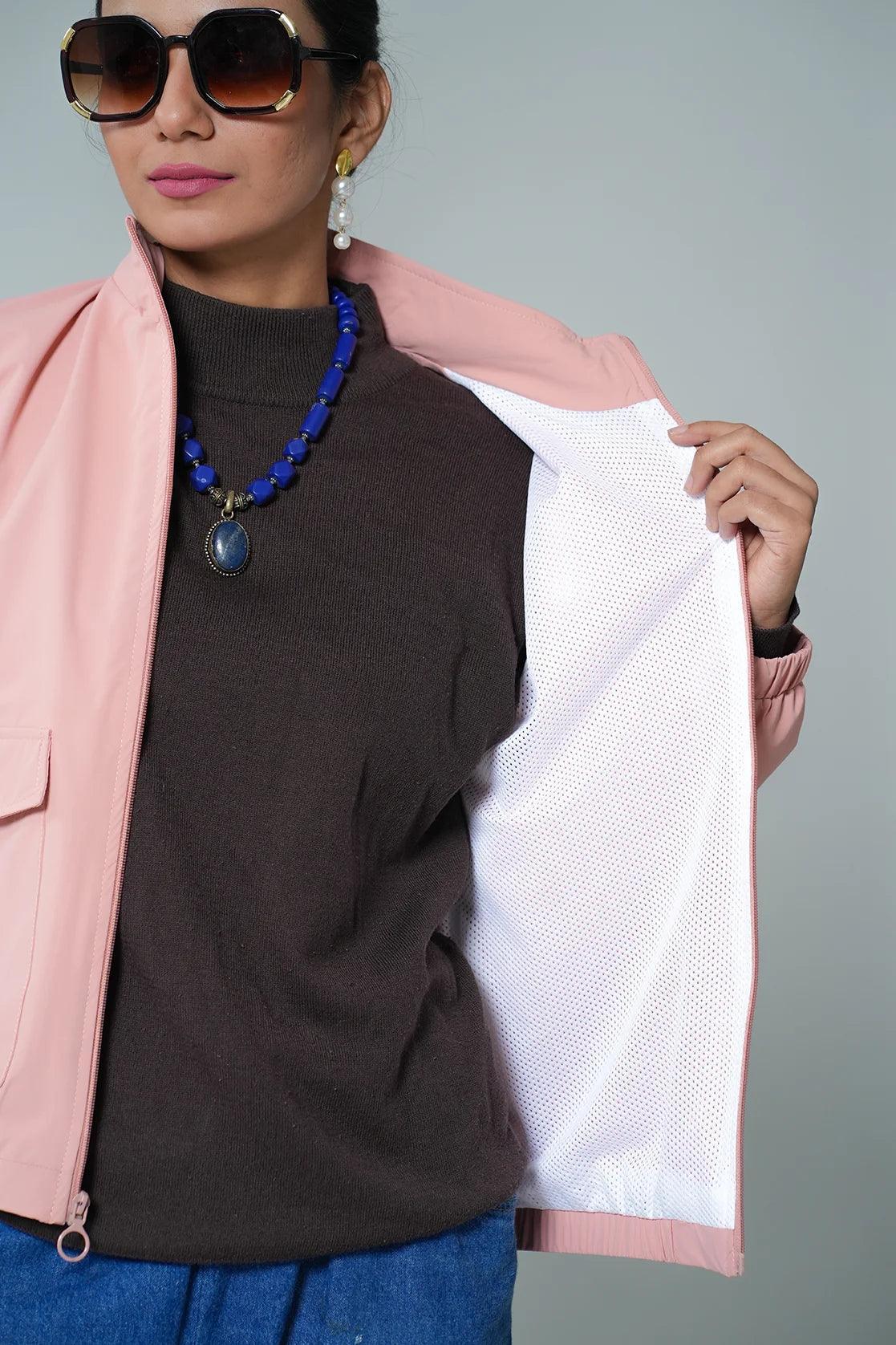 Upgrade your wardrobe with the trendy Fort Collins Women's Pink Windbreaker Jacket, featuring a Mesh-Net Lining. Now available for online purchase from anywhere in India.