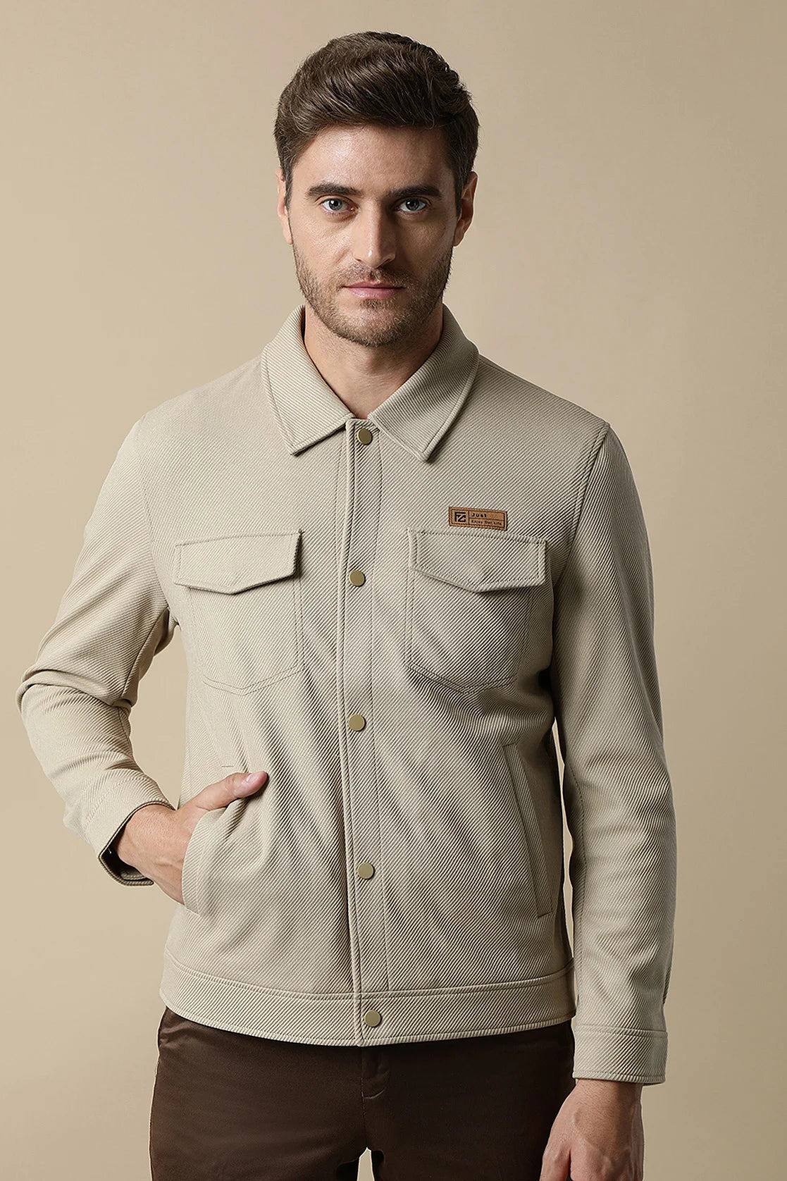 Elevate your wardrobe with the Fort Collins Men's Button-Up Knitted Jacket in beige, available for online purchase from any location in India. Refresh your style with this trendy and practical option.