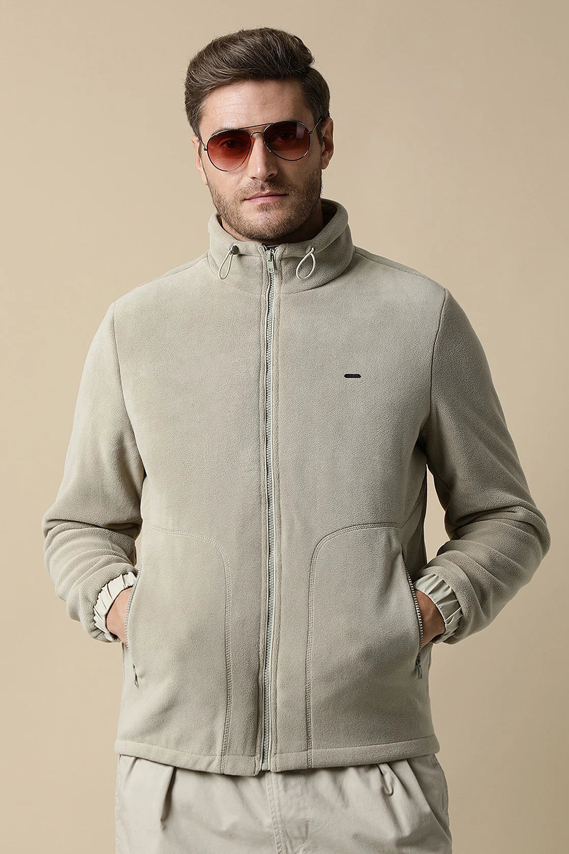 Upgrade your wardrobe with the Fort Collins Men's Beige Fleece Jacket, available for online purchase from anywhere in India. Don't miss out on this trendy and versatile jacket with a convenient zip-up front.