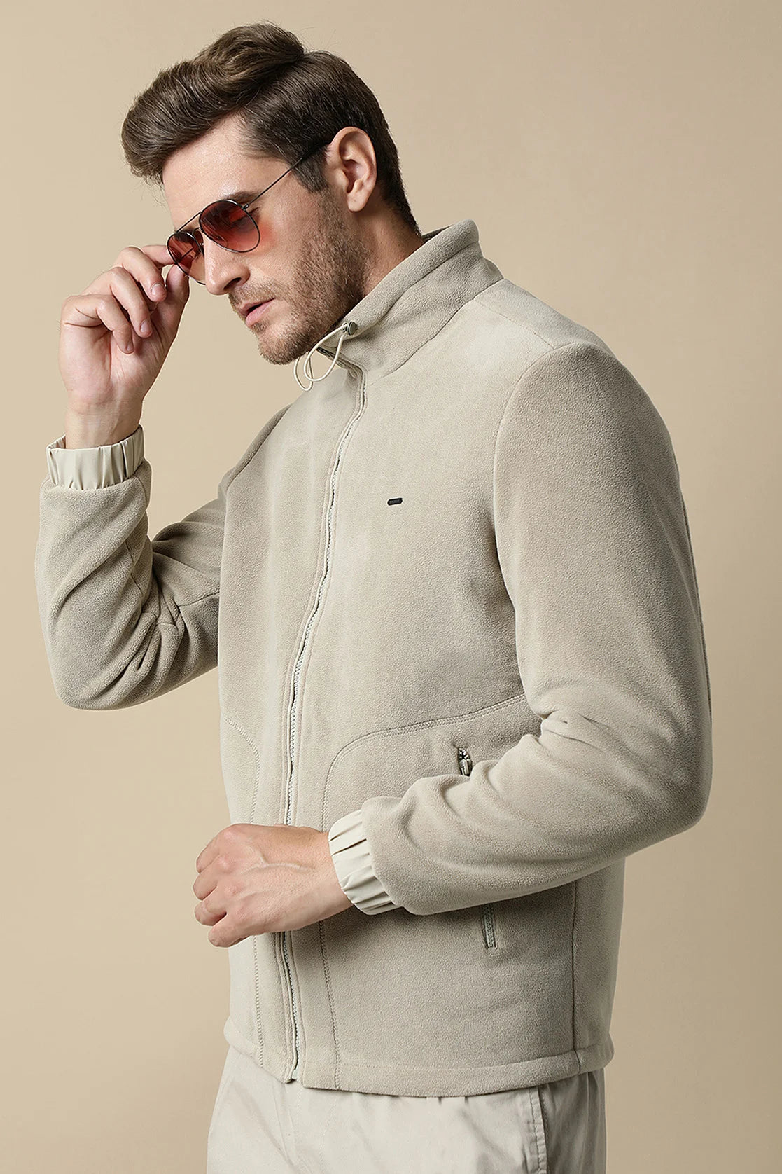 Upgrade your wardrobe with the Fort Collins Men's Beige Fleece Jacket, featuring a convenient zip-up front. Order online for easy access to this stylish piece from anywhere in India.