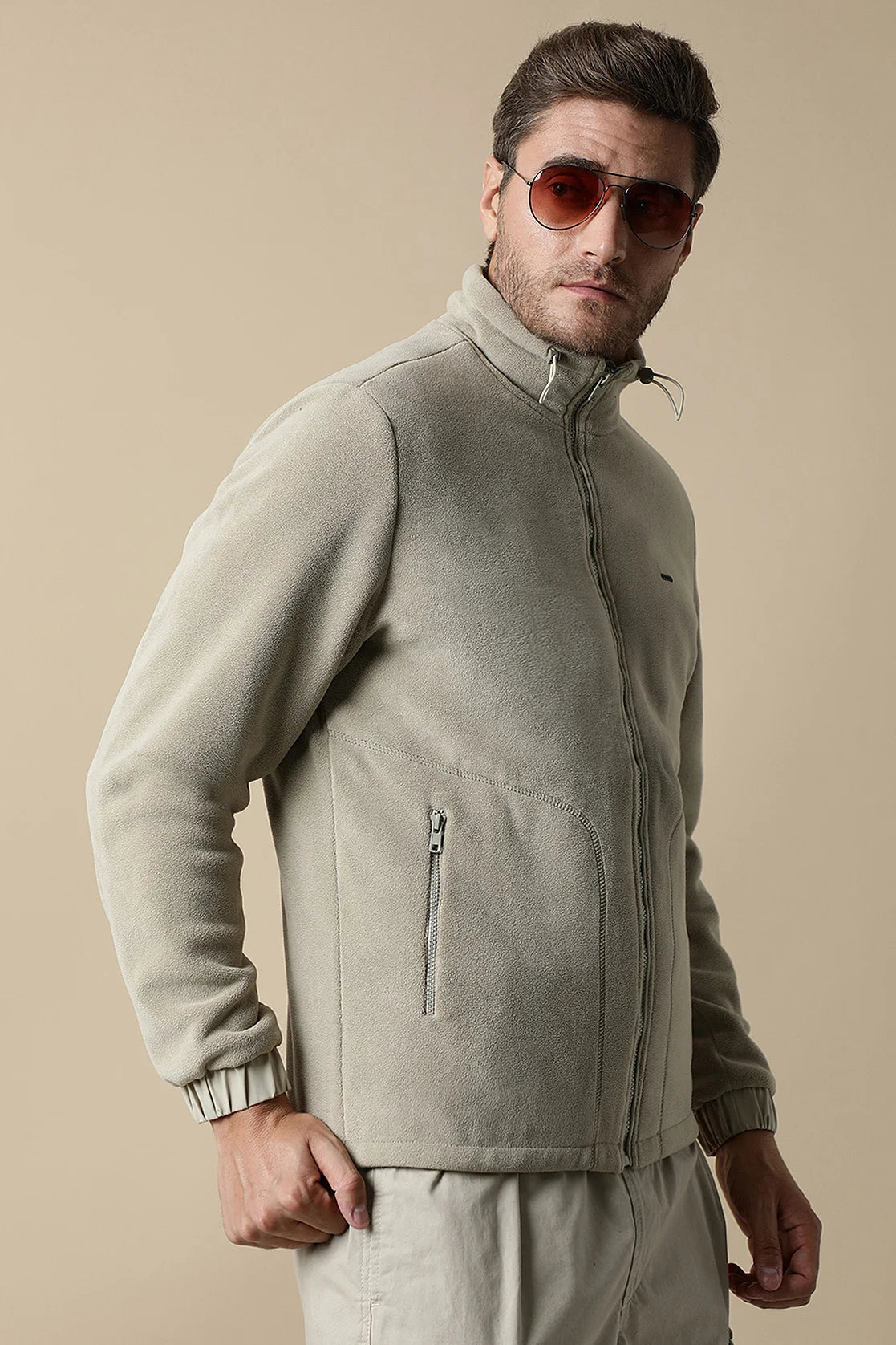 Discover the versatile Fort Collins Men's Beige Fleece Jacket with Zip-Up Front, perfect for upgrading your wardrobe. Shop online for this stylish option from anywhere in India.