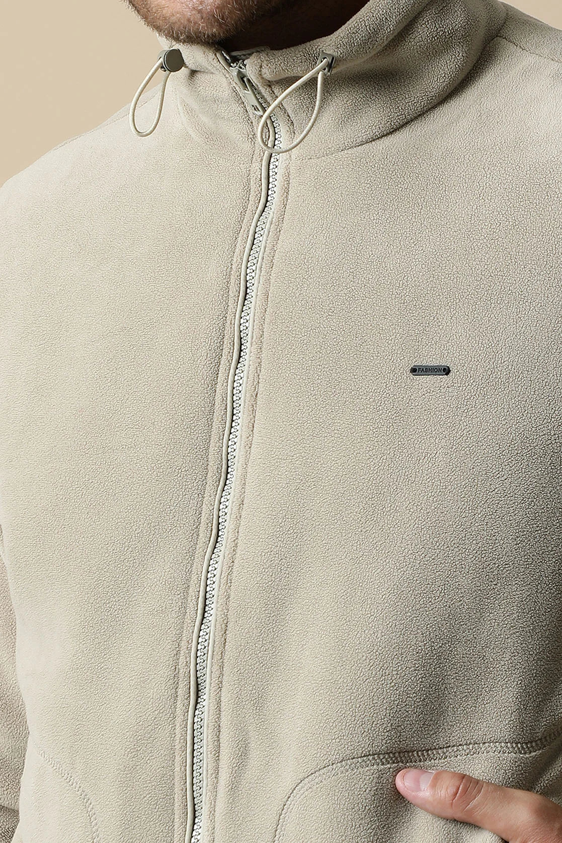 Purchase a stylish upgrade for your wardrobe with the Fort Collins Men's Beige Fleece Jacket. This zip-up front jacket is available for online shopping from anywhere in India.