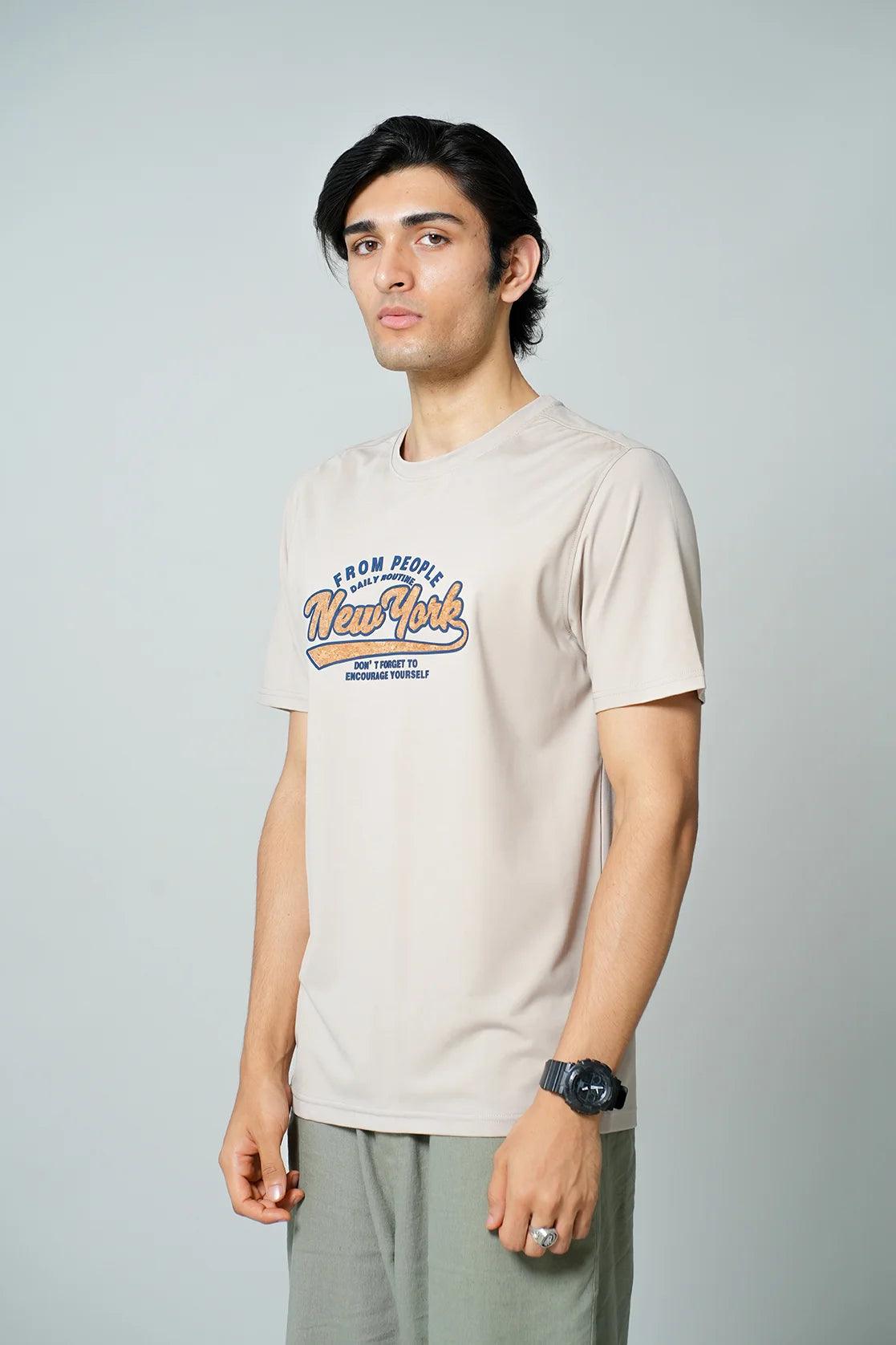 Discover the stylish upgrade for your wardrobe with the Fort Collins Men's Beige Stretchable T-Shirt showcasing a New York graphic print. Shop online from anywhere in India today.