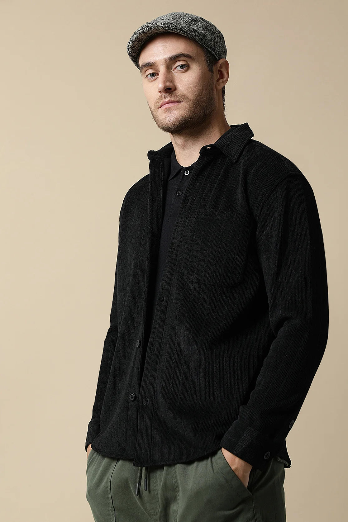 Enhance your wardrobe with the Fort Collins Men's Black Knitted Button Down Shacket. This stylish piece is available online, making it easy to upgrade your look from anywhere in India.