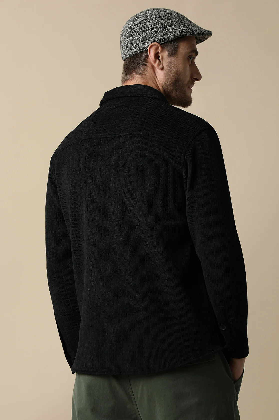 Upgrade your wardrobe with the Men's Black Knitted Button Down Shacket from Fort Collins. Shop now for a stylish addition to your closet, available online in India.