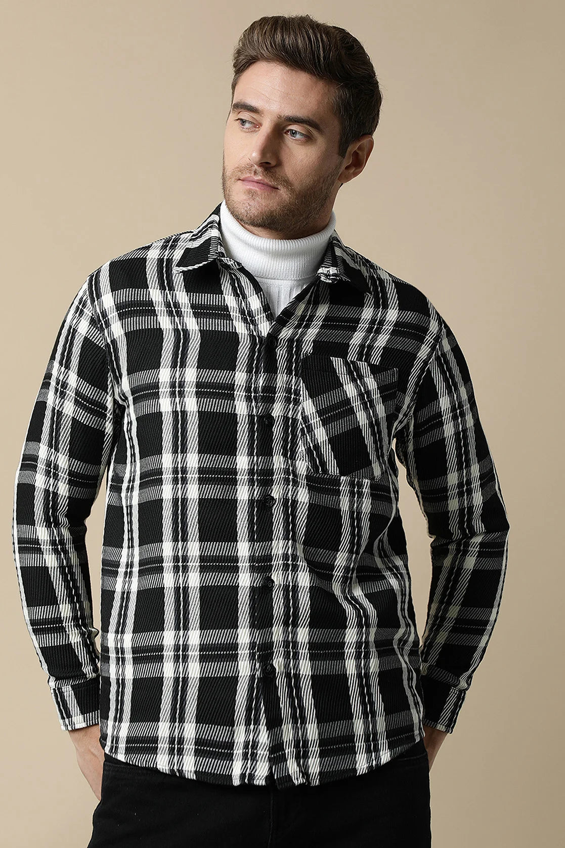 Enhance your wardrobe with our Men's Black Knitted Plaid Shacket from Fort Collins, now available for purchase online from anywhere in India. Stay stylish and on-trend with this versatile piece.