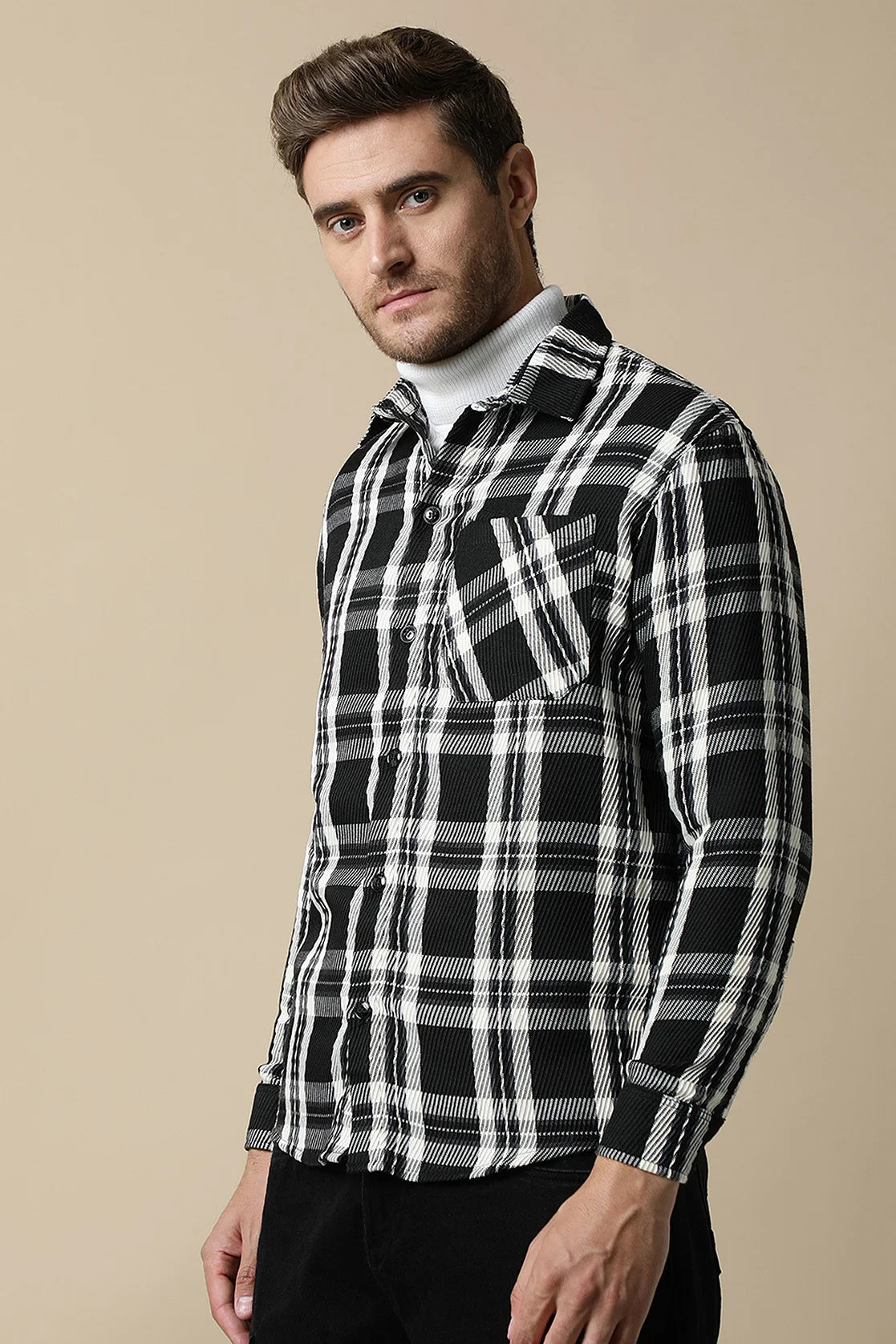 Elevate your wardrobe with the stylish and versatile Fort Collins Men's Black Knitted Plaid Shacket, now available for purchase from anywhere in India. Perfect for fashion-savvy individuals looking to stay on trend.