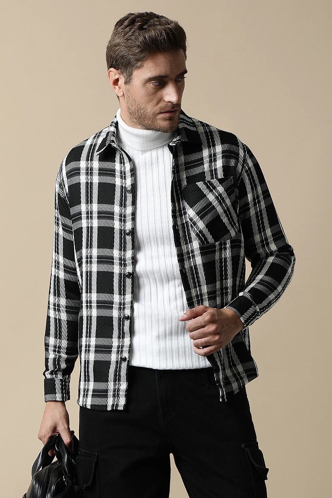 Elevate your wardrobe with our Fort Collins Men's Black Knitted Plaid Shacket. Shop online for the latest trend in fashion from anywhere in India.