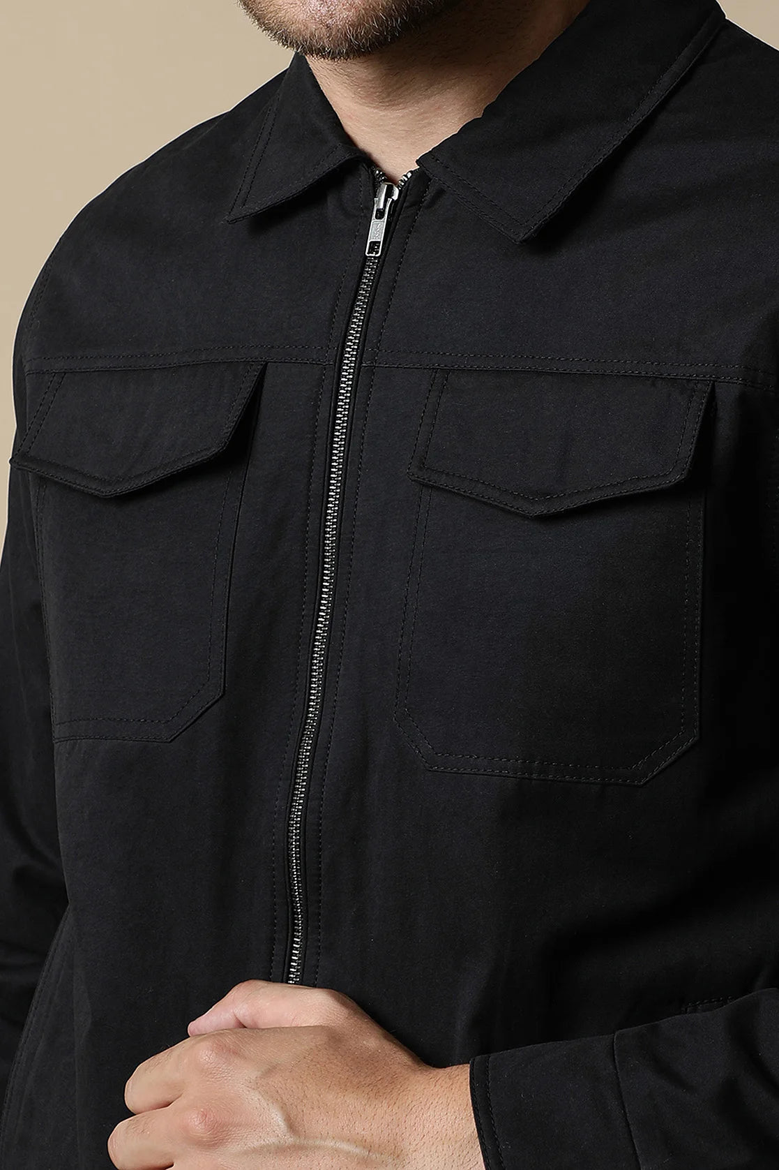 Discover the sleek Fort Collins Men's Black Lightweight Jacket, featuring dual chest pockets. Elevate your wardrobe with this stylish option, available for purchase online from anywhere in India.