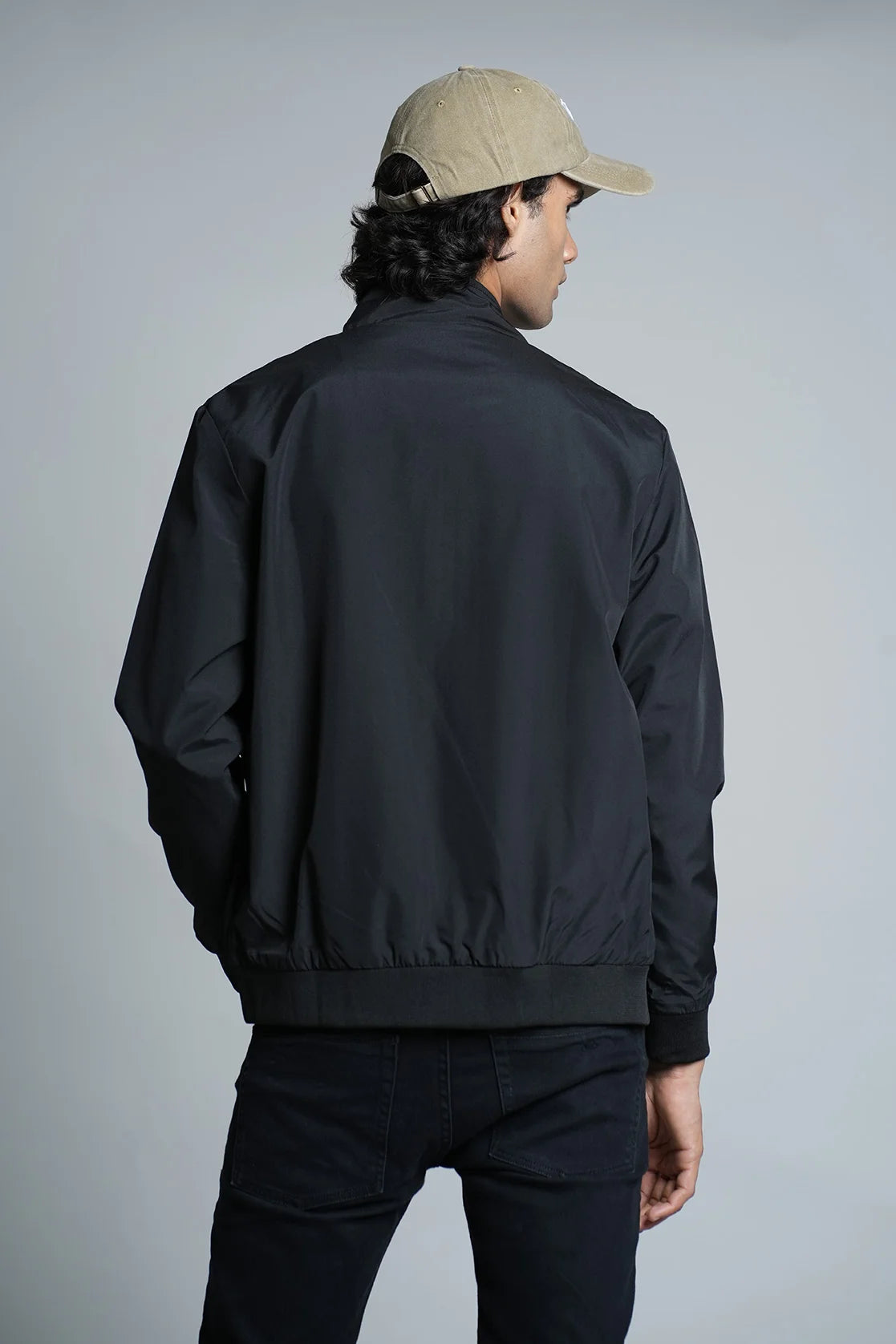 Elevate your wardrobe with the Men's Black Lightweight Windbreaker Jacket by Fort Collins, available for online purchase in India. Stay stylish and protected with this trend-setting jacket.