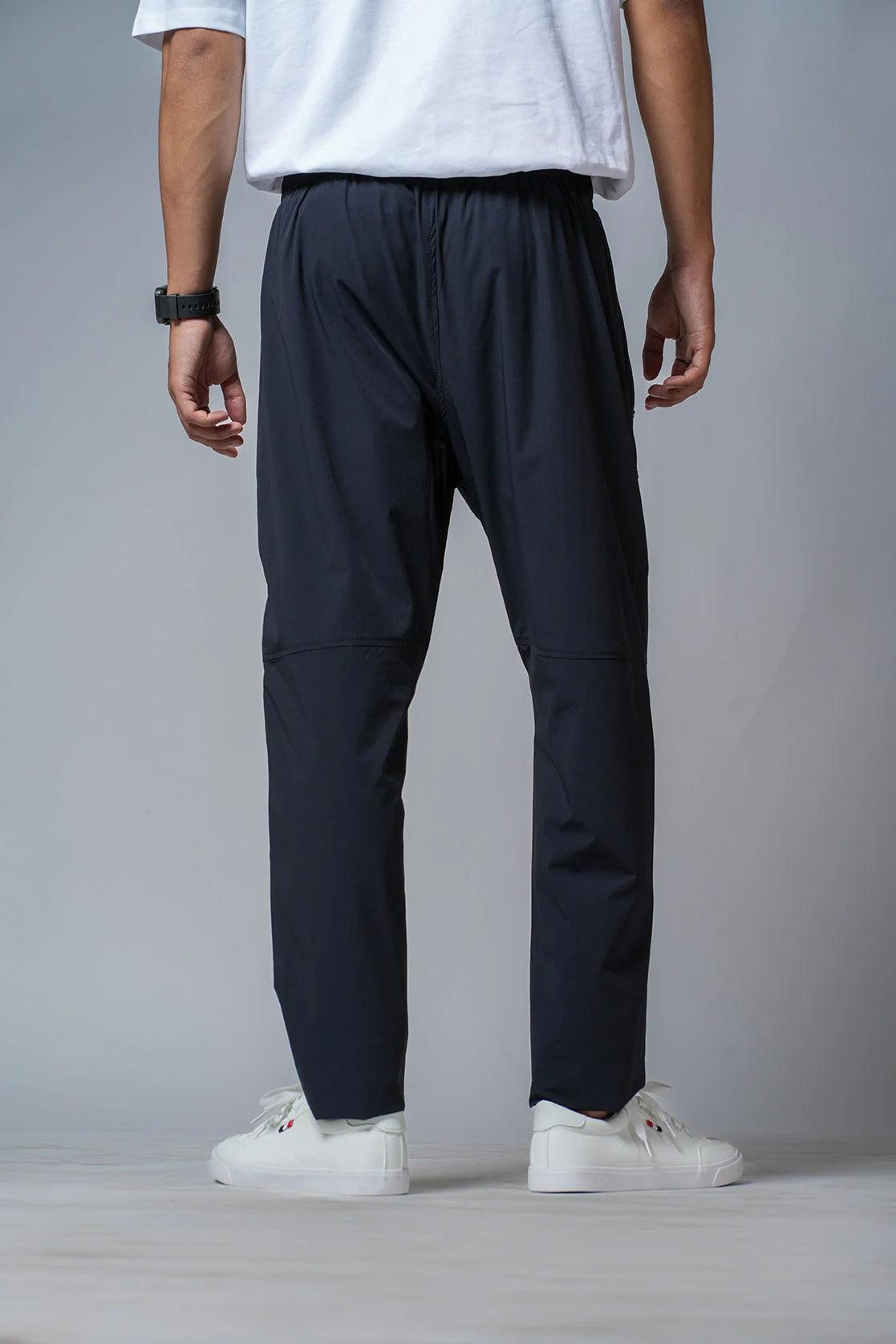 Discover the Fort Collins Men's Black Regular Fit Polyester-Lycra Track Pant, available for purchase online in India. Expertly designed for comfort and performance, with zipper pockets for added convenience.