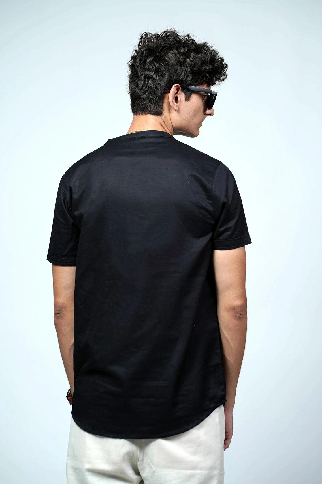 This Men's Black Relaxed Fit Mandarin Collar T-Shirt Kurta features a chest pocket for added convenience.