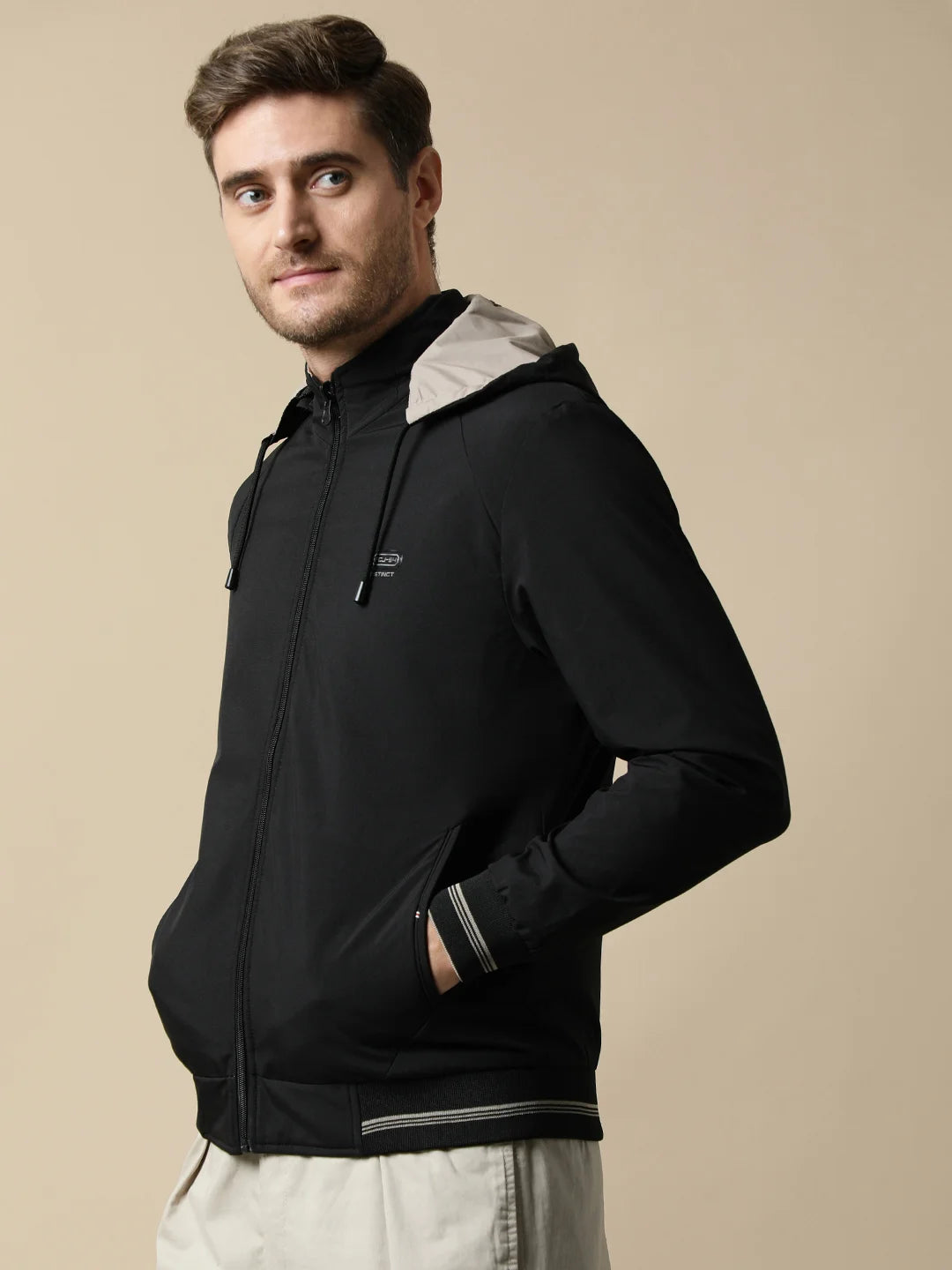 Elevate your style with the Fort Collins Men's Black Reversible Windbreaker, complete with a detachable hood. Perfect for those looking for a versatile and fashionable addition to their wardrobe. Shop now online from anywhere in India.