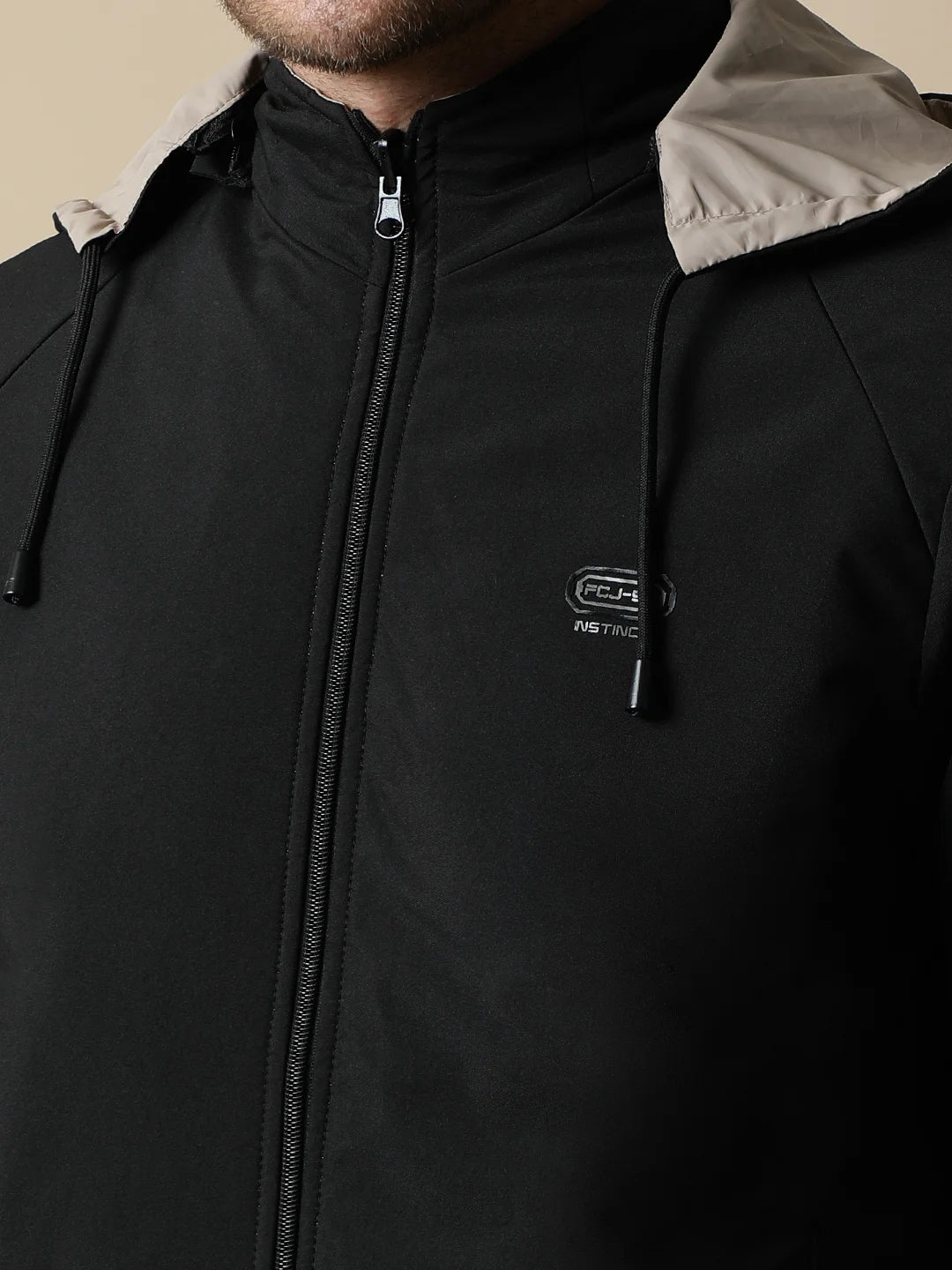 Purchase the Fort Collins Men's Black Reversible Windbreaker, complete with detachable hood, online from anywhere in India for a fashionable addition to your wardrobe.