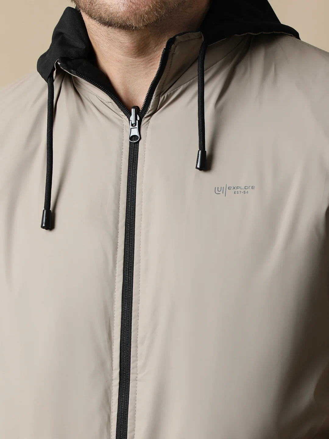 Purchase the Men's Black Reversible Windbreaker With Detachable Hood from Fort Collins for a trendy addition to your wardrobe. Available online, with shipping to any location in India.