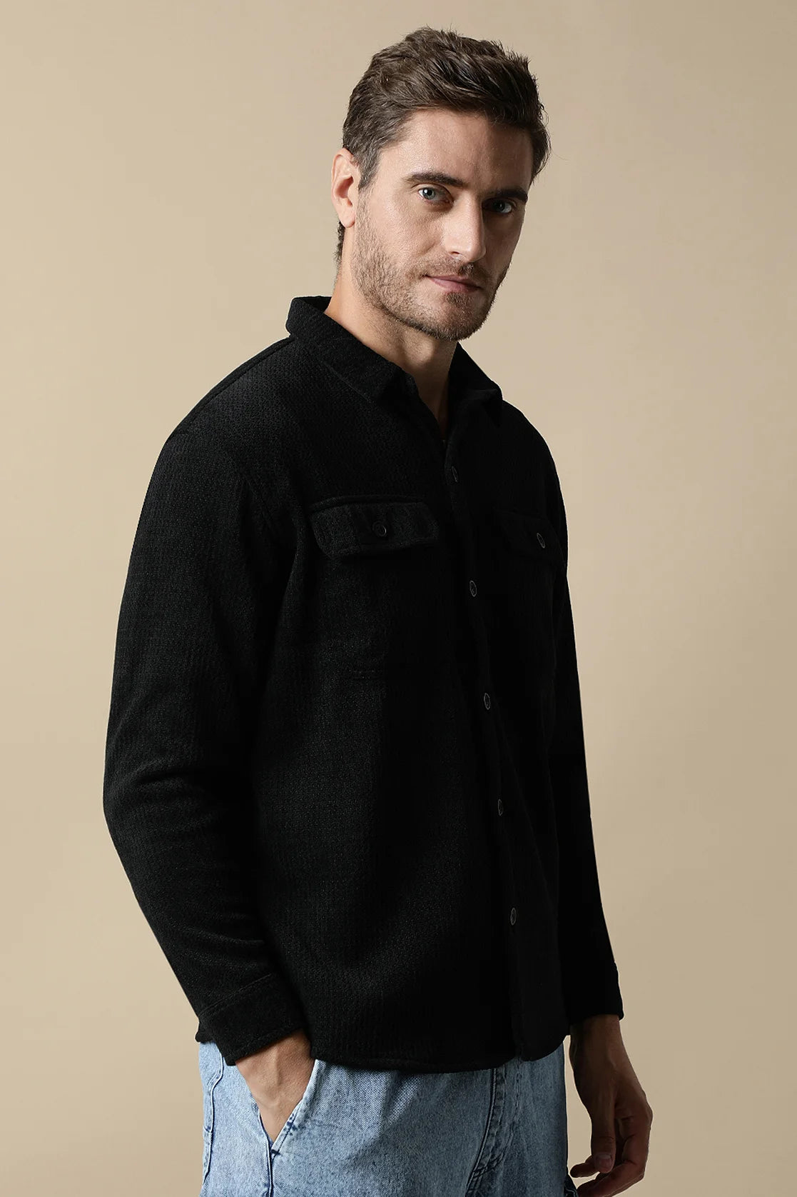 Upgrade your wardrobe with the Men's Black Textured Shacket from Fort Collins. Featuring dual chest pockets, this trendy piece is perfect for any fashion-forward individual. Shop now online from anywhere in India.