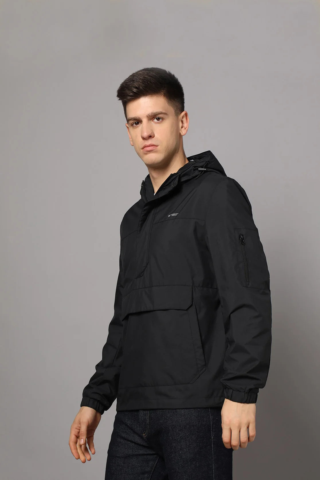 Upgrade your wardrobe with this Men's Black Windbreaker Jacket from Fort Collins. It features an adjustable hood and mesh-net lining, providing both style and functionality. Available online for easy shopping and delivery from anywhere in India.