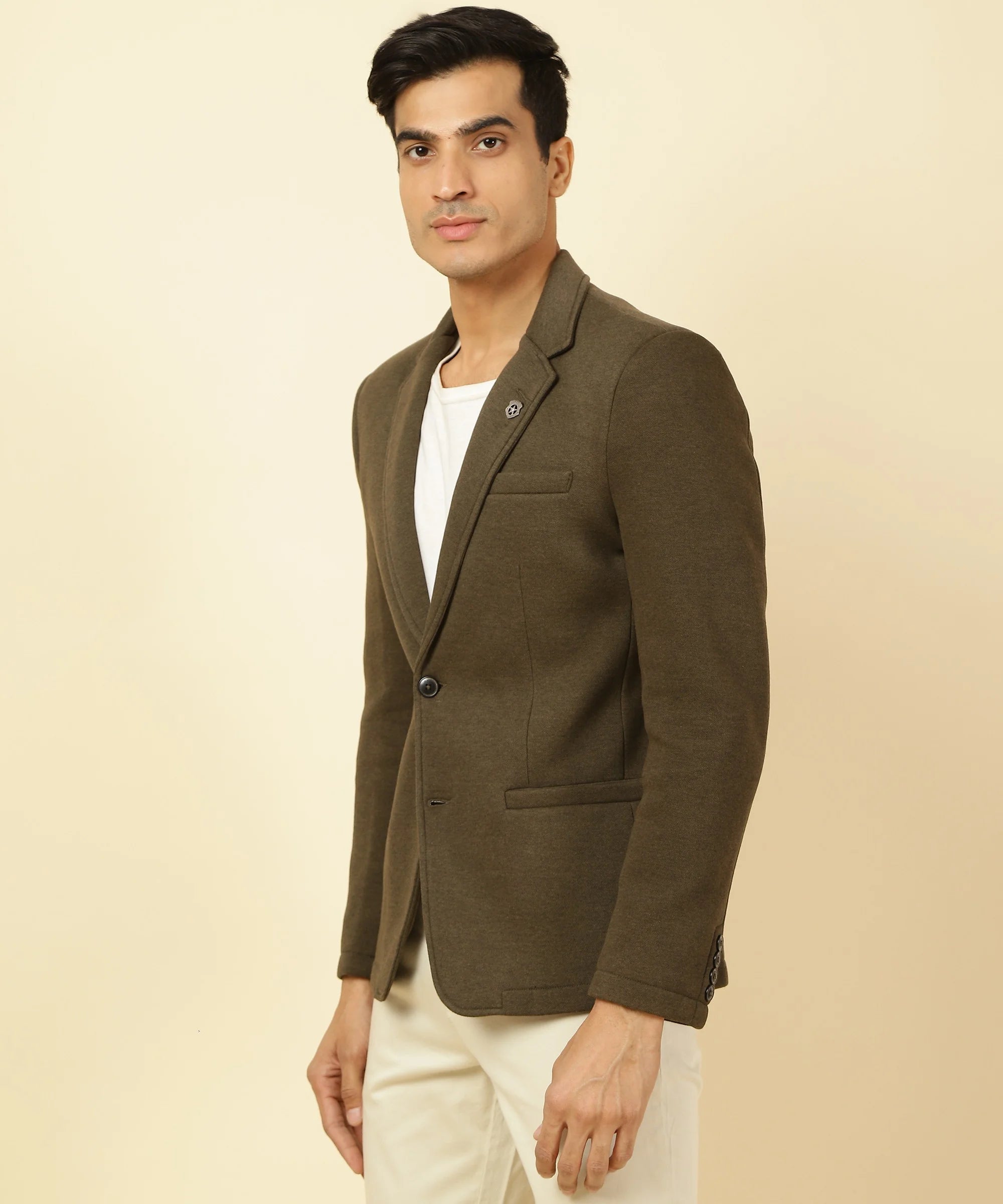 Upgrade your wardrobe with Fort Collins' Men's Brown Melange Knitted Blazer featuring a notched lapel. Available for online purchase in India.