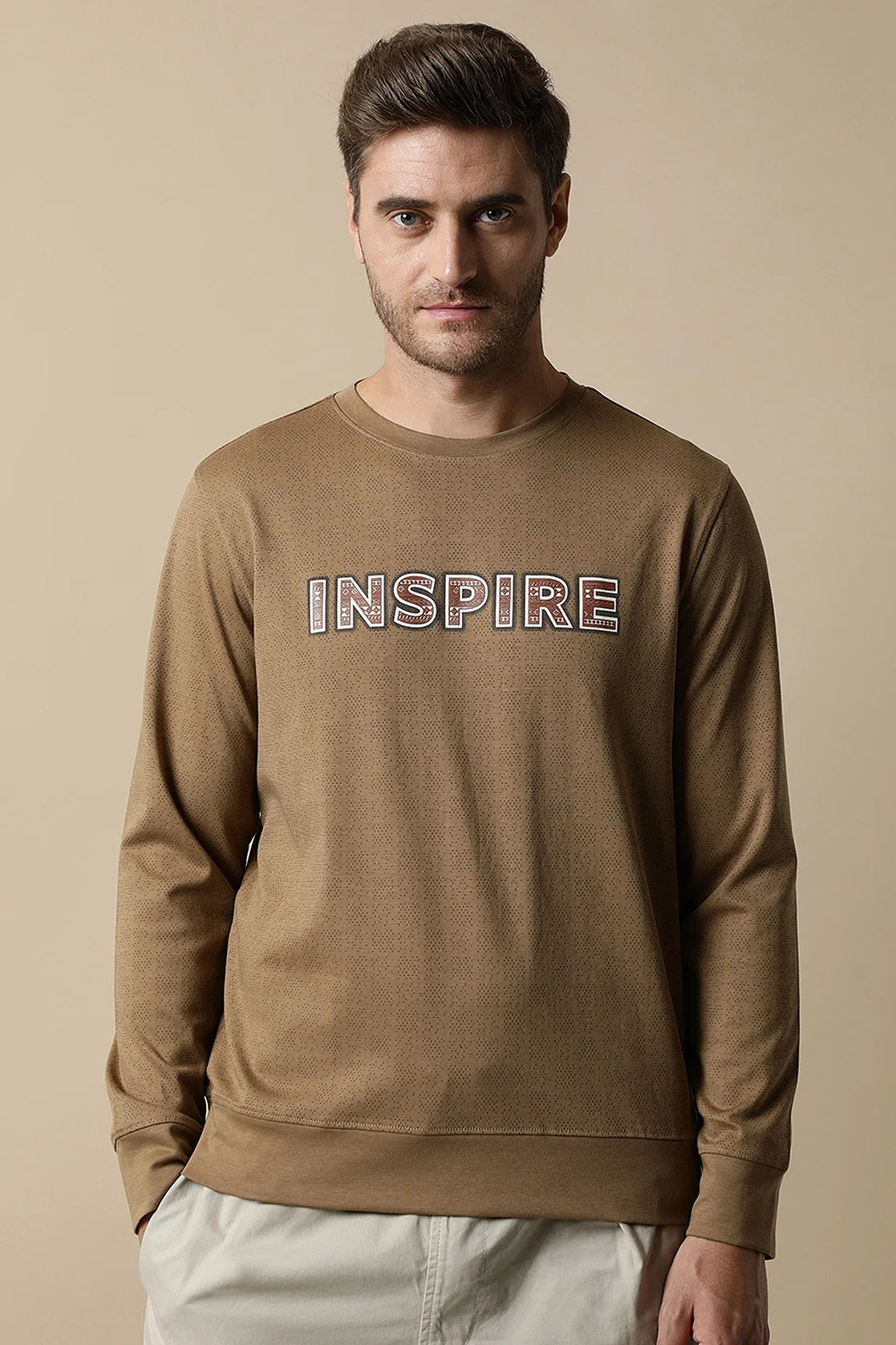 Discover the latest Men's Camel Color Round Neck Sweatshirt with Chest Print from Fort Collins. Shop now and elevate your wardrobe with a stylish touch, available online throughout India.