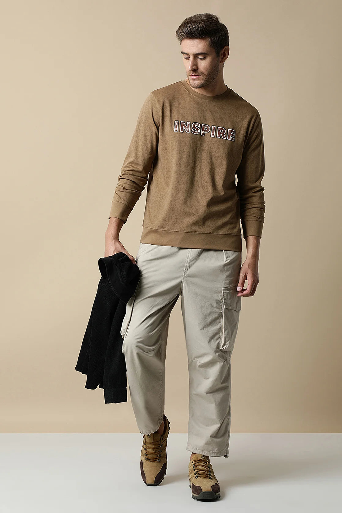 Discover the timeless style of the Fort Collins Men's Camel Color Round Neck Sweatshirt with Chest Print. Available for online purchase, this trendy wardrobe addition is perfect for any fashion-forward individual in India.