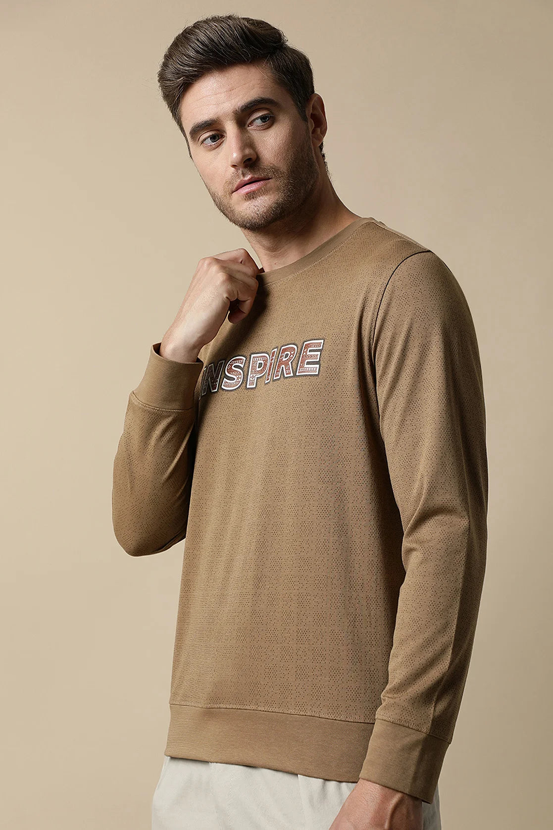 Shop now online for a trendy wardrobe from anywhere in India with the Fort Collins Men's Camel Color Round Neck Sweatshirt featuring a chest print.