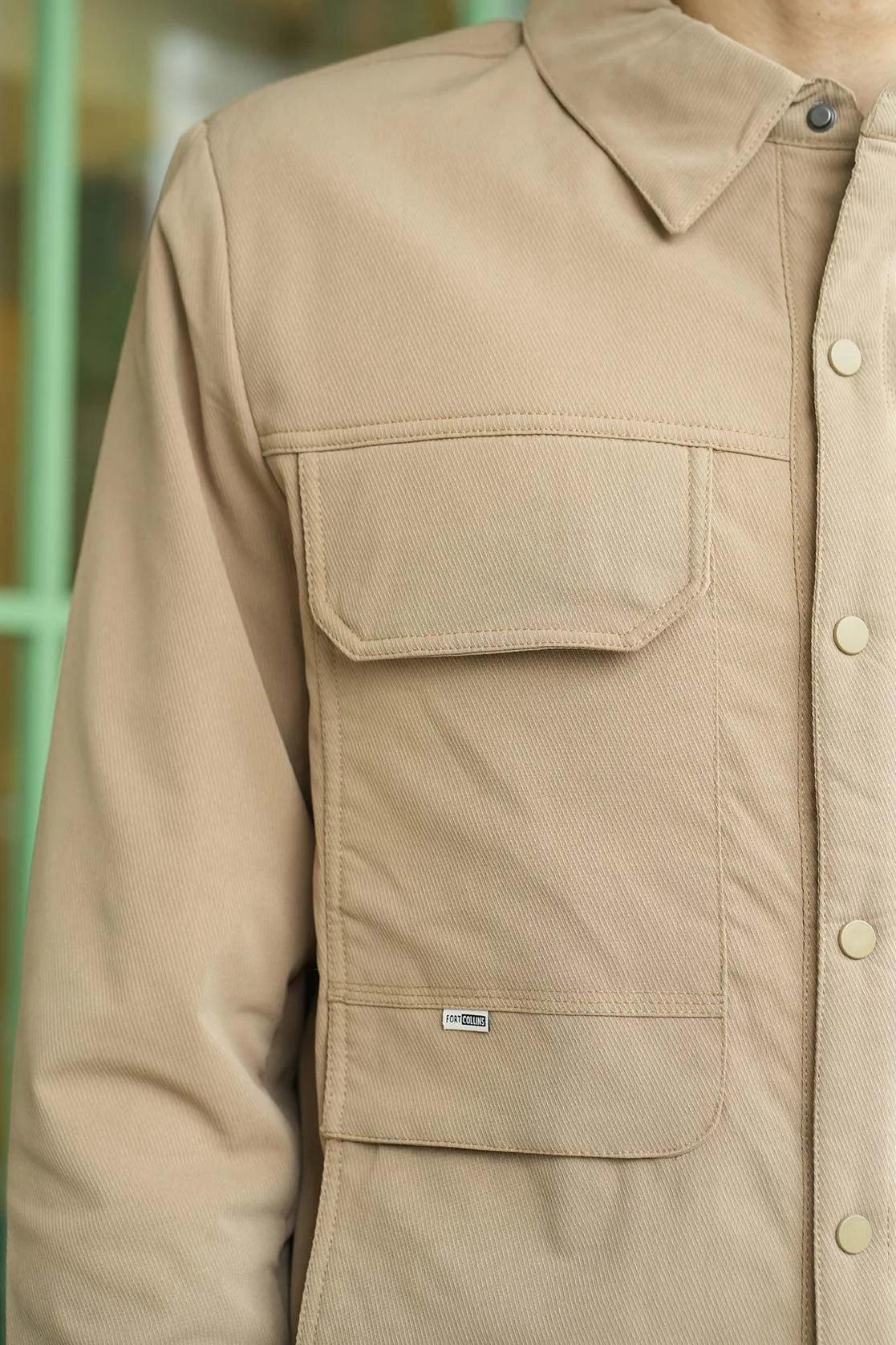 The Men's Classic Twill Utility Shacket in Khaki for Fort Collins is now available for purchase online in India.