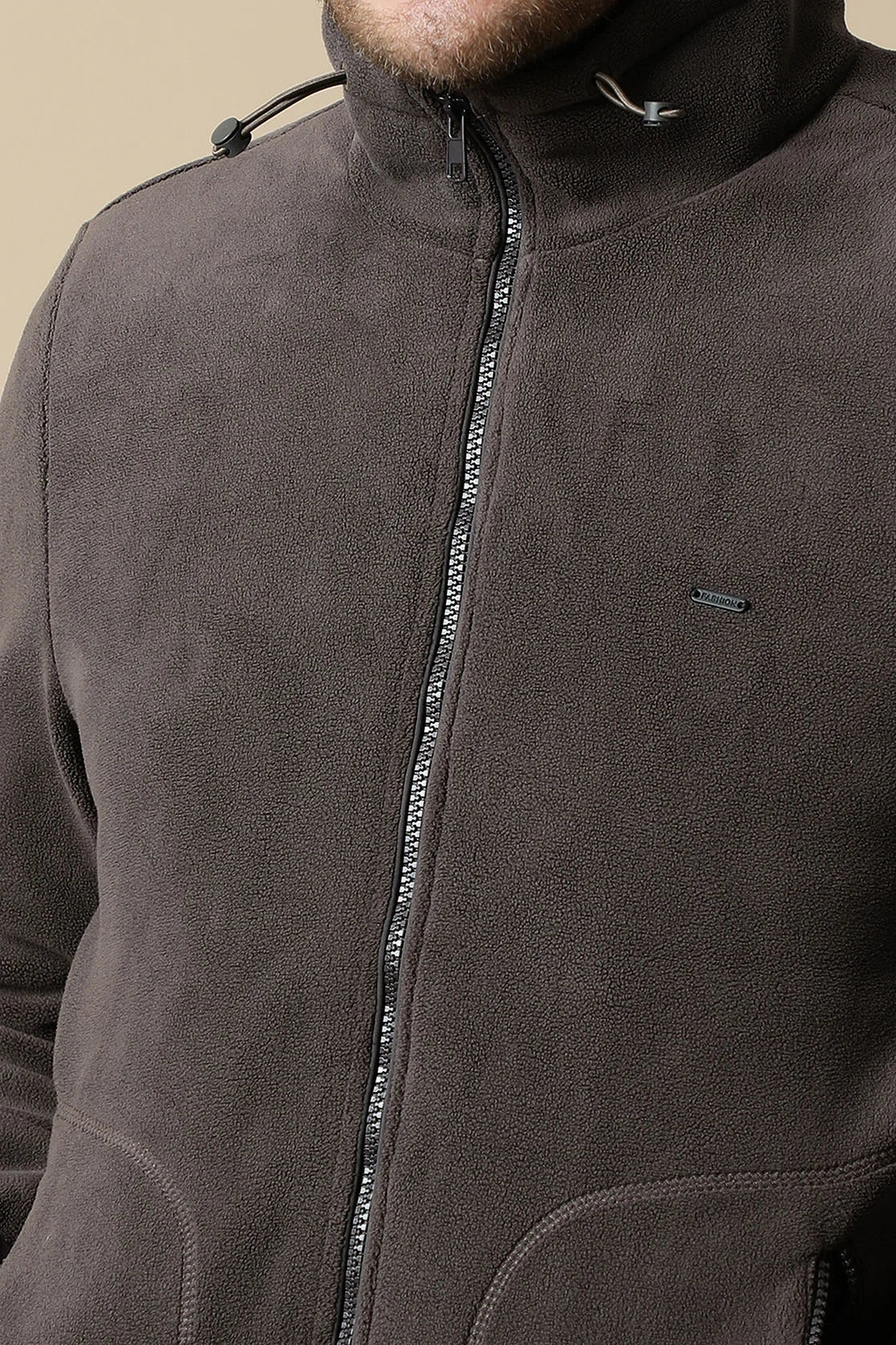 Upgrade your wardrobe with the Fort Collins Men's Coffee Brown Fleece Jacket in India. With its zip-up front, this trendy jacket is ideal for any occasion.