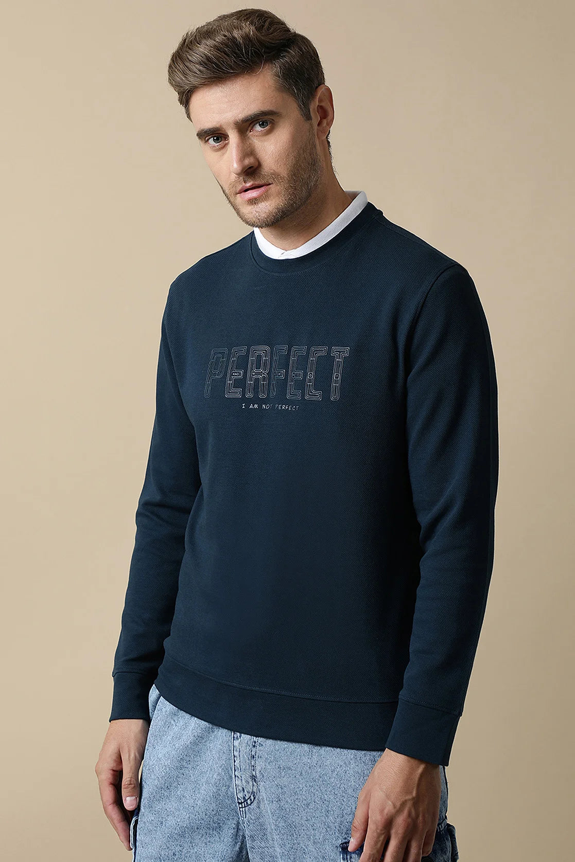 Shop online for a fashionable wardrobe from anywhere in India with Fort Collins Men's Dark Blue Round Neck Sweatshirt, featuring an embossed chest print.