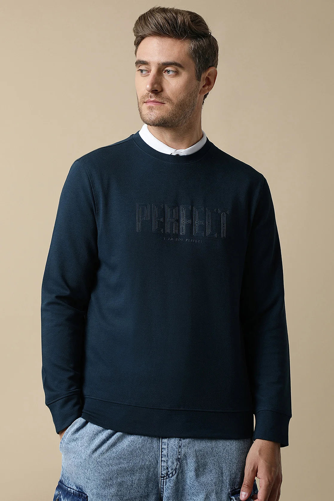 Discover the perfect addition to your wardrobe with this Men's Dark Blue Round Neck Sweatshirt from Fort Collins. Featuring a stylish embossed chest print, this sweatshirt is a must-have for any fashion-forward individual. Shop online now for this on-trend piece, available for purchase from anywhere in India.