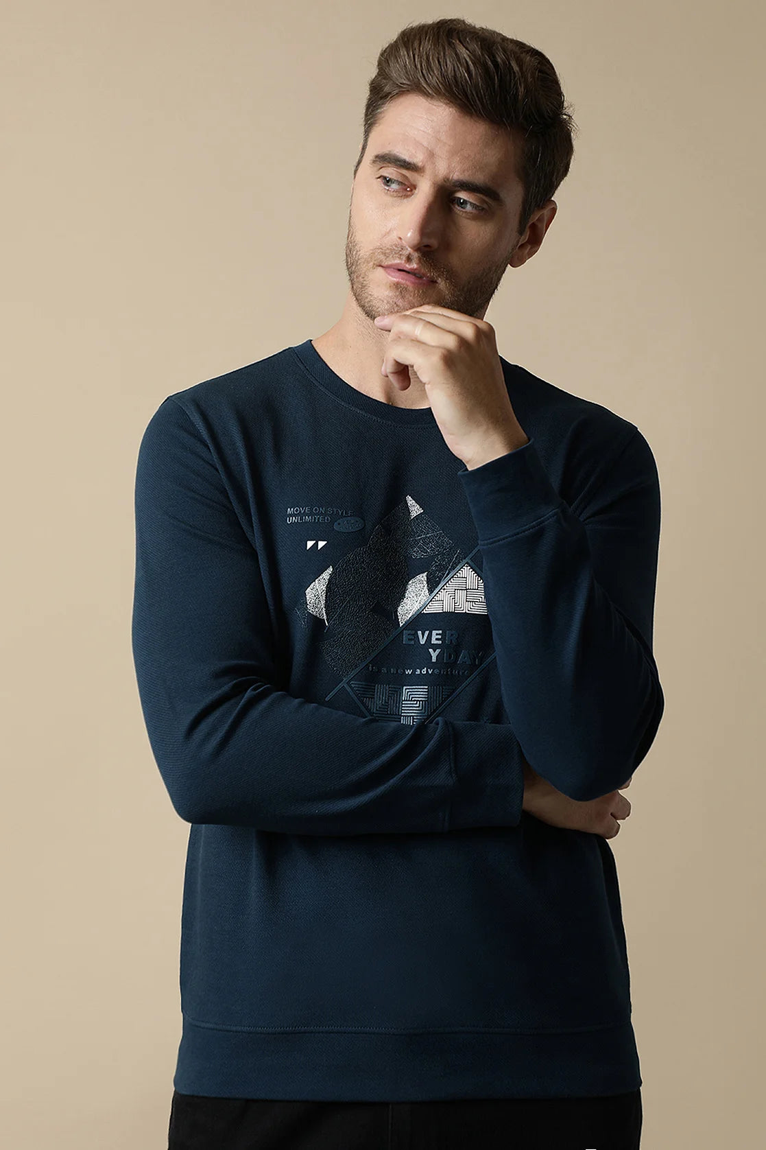 Purchase the Fort Collins Men's Dark Blue Round Neck Sweatshirt with Embossed Graphic online for a fashionable addition to your wardrobe in India.