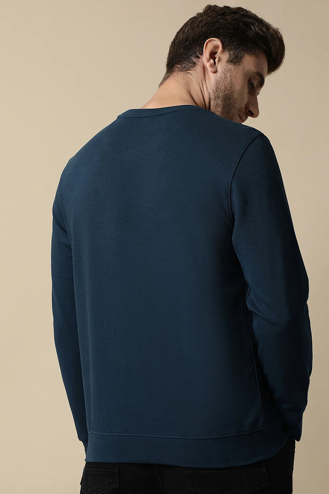 Discover the Men's Dark Blue Round Neck Sweatshirt with Embossed Graphic from Fort Collins. This must-have piece adds style and versatility to your wardrobe. Shop now for effortless online shopping from anywhere in India.