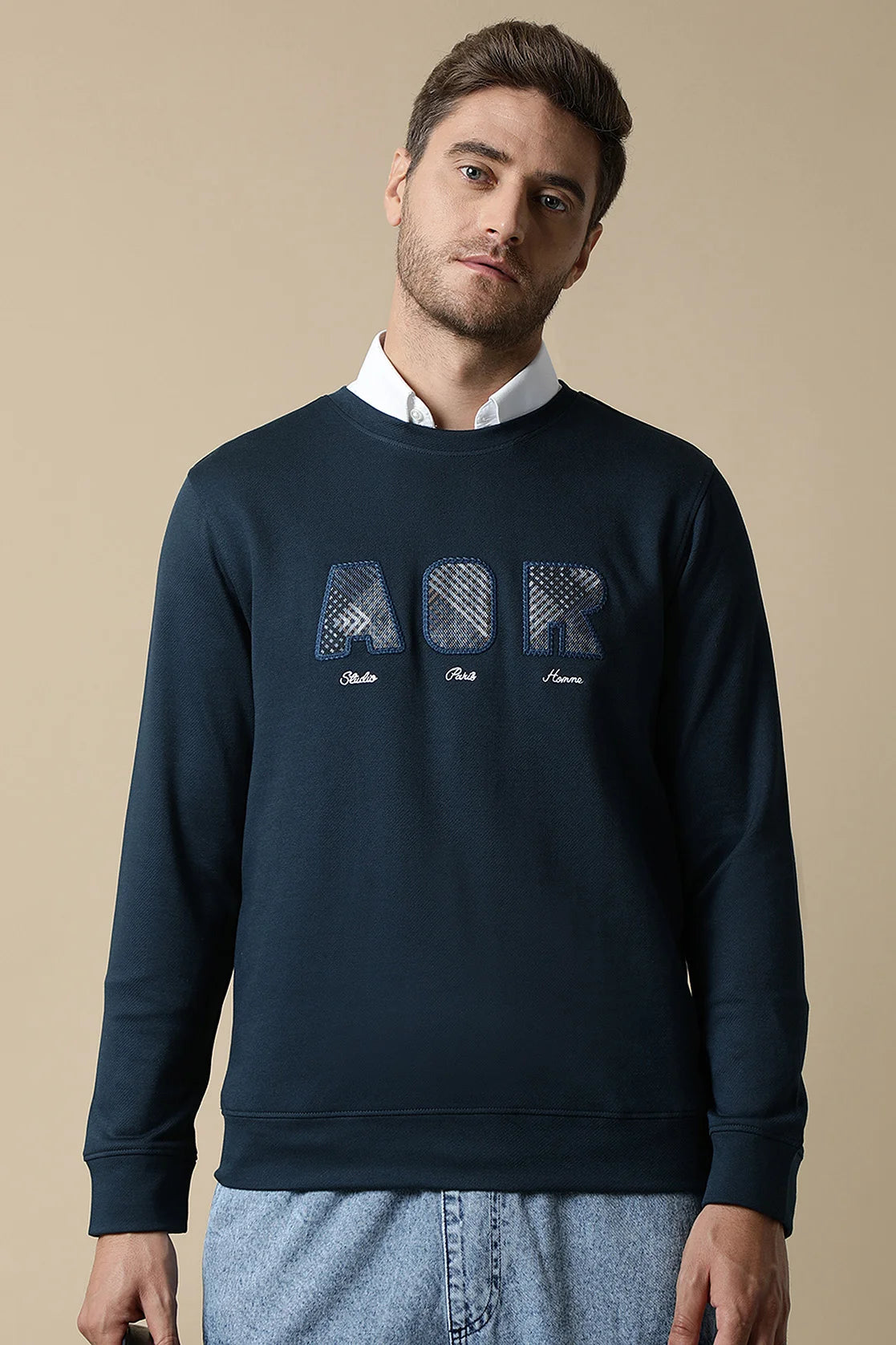 Stay on top of fashion with the Men's Dark Blue Sweatshirt with Embroidered Chest Design from Fort Collins. Experience trendy style from anywhere in India - shop online now.