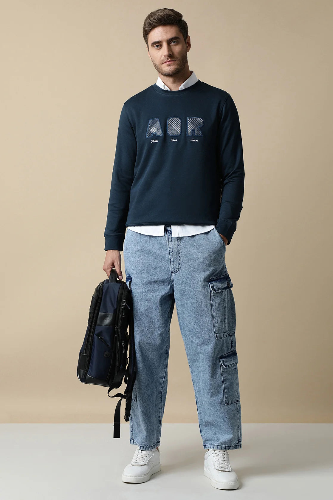 Shop now online for a stylish wardrobe from anywhere in India with the Men's Dark Blue Sweatshirt featuring an embroidered chest design by Fort Collins.