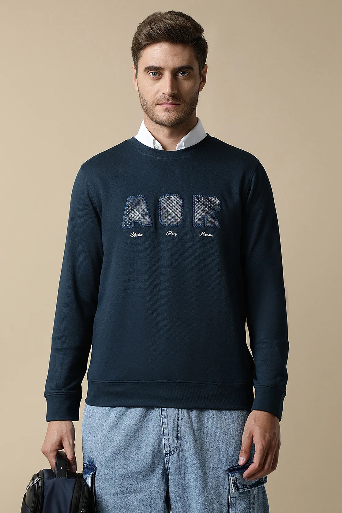 Discover the stylish Men's Dark Blue Sweatshirt with Embroidered Chest Design created by Fort Collins. Purchase it today to elevate your wardrobe with the latest fashion trends, available for online shopping within India.