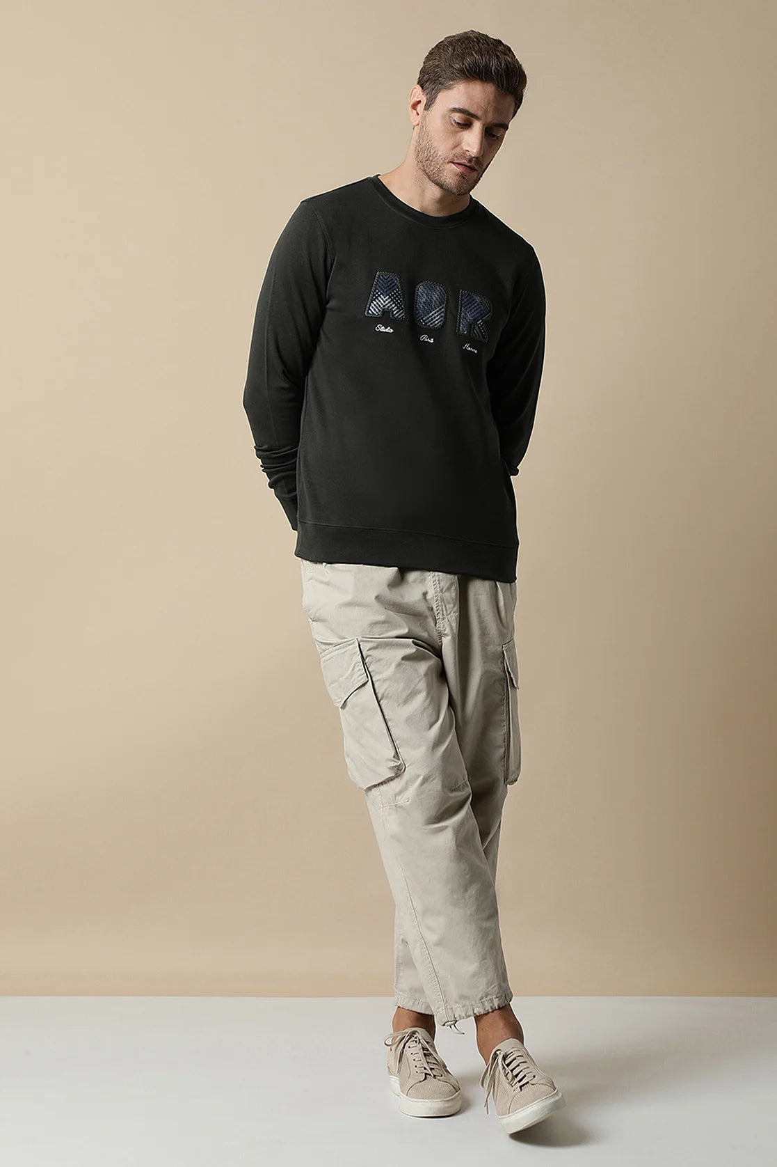 Shop for a stylish Indian wardrobe with the Men's Dark Green Sweatshirt featuring an Embroidered Chest Design, brought to you by Fort Collins. Available online, anywhere in India.