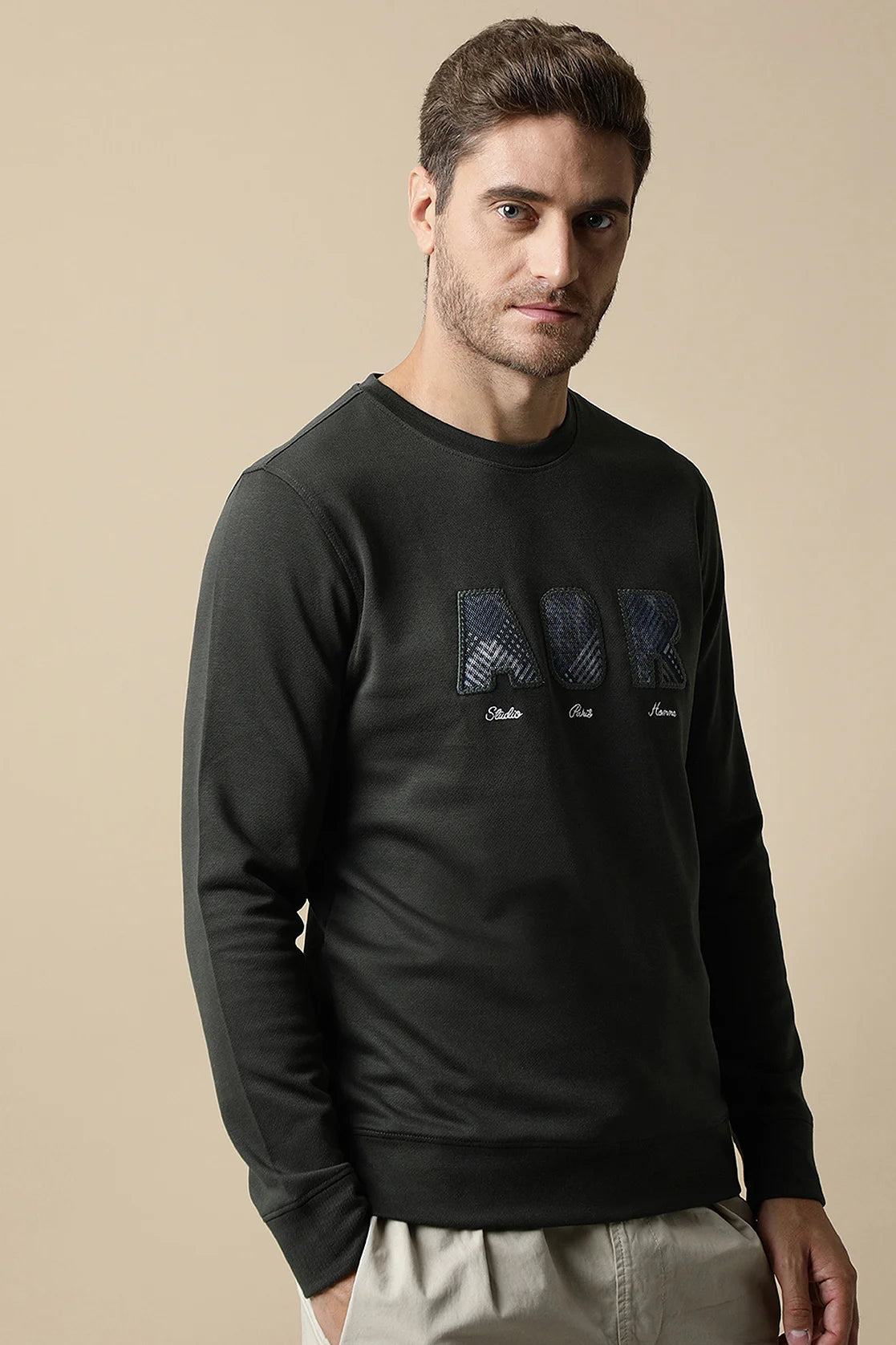 Discover the Fort Collins Men's Dark Green Sweatshirt with Embroidered Chest Design, available for purchase online from anywhere in India. Perfect for a stylish addition to your wardrobe.