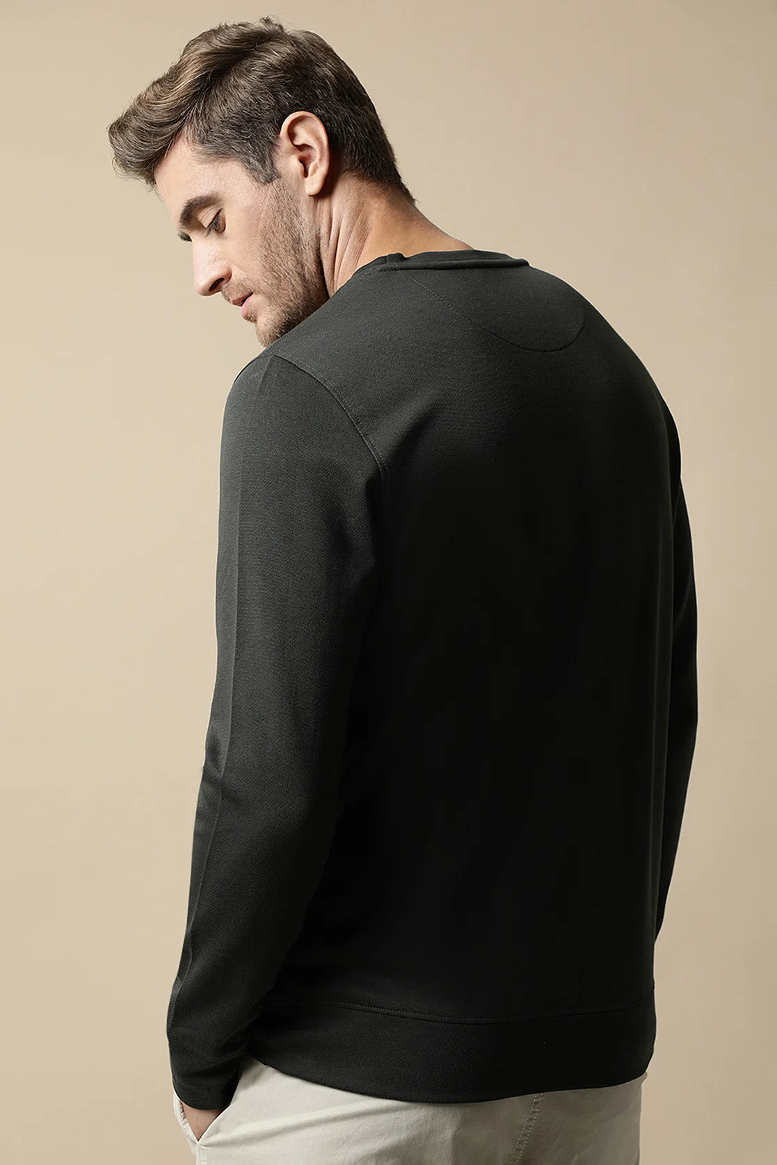 Discover the perfect addition to your wardrobe with Fort Collins' Men's Dark Green Sweatshirt, featuring an embroidered chest design. Shop online from anywhere in India for the latest fashion!