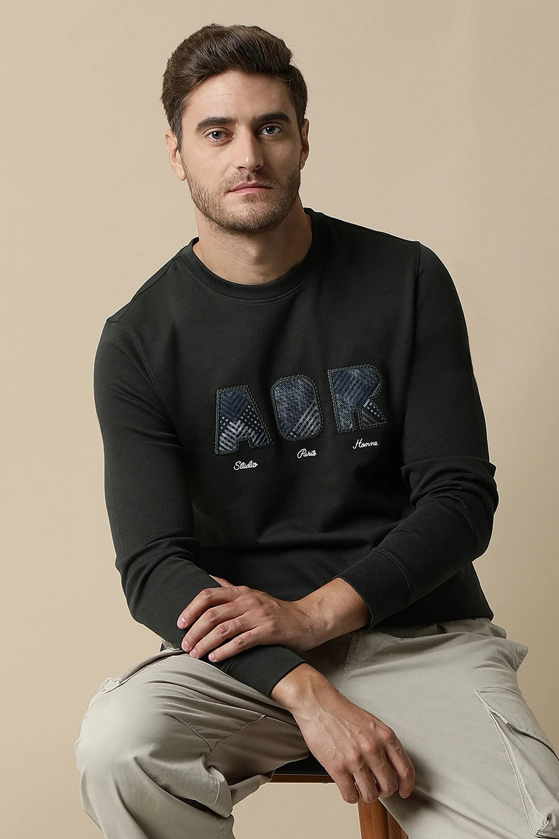 Discover the fashionable Men's Dark Green Sweatshirt with Embroidered Chest Design By Fort Collins. Shop now for a wardrobe upgrade, available online in India.