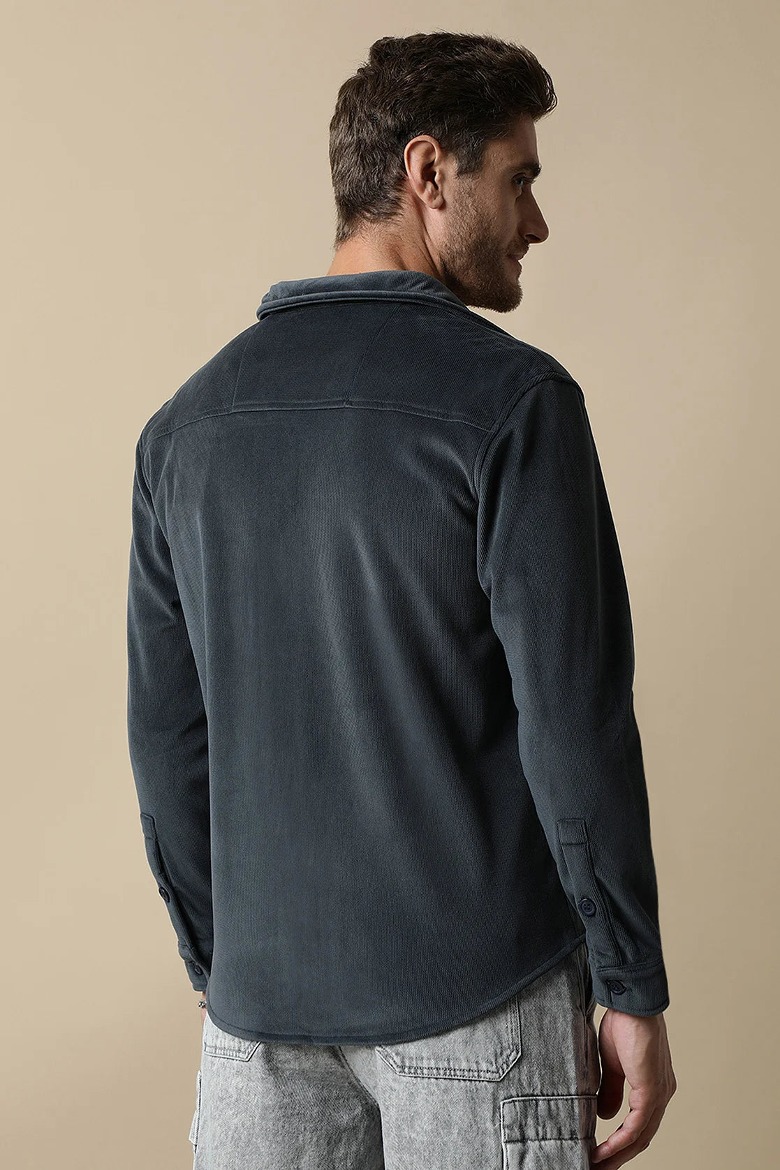 Discover a stylish upgrade for your wardrobe with the Fort Collins Men's Dark Grey Corduroy Shacket featuring dual chest pockets. Available for purchase online from anywhere in India.