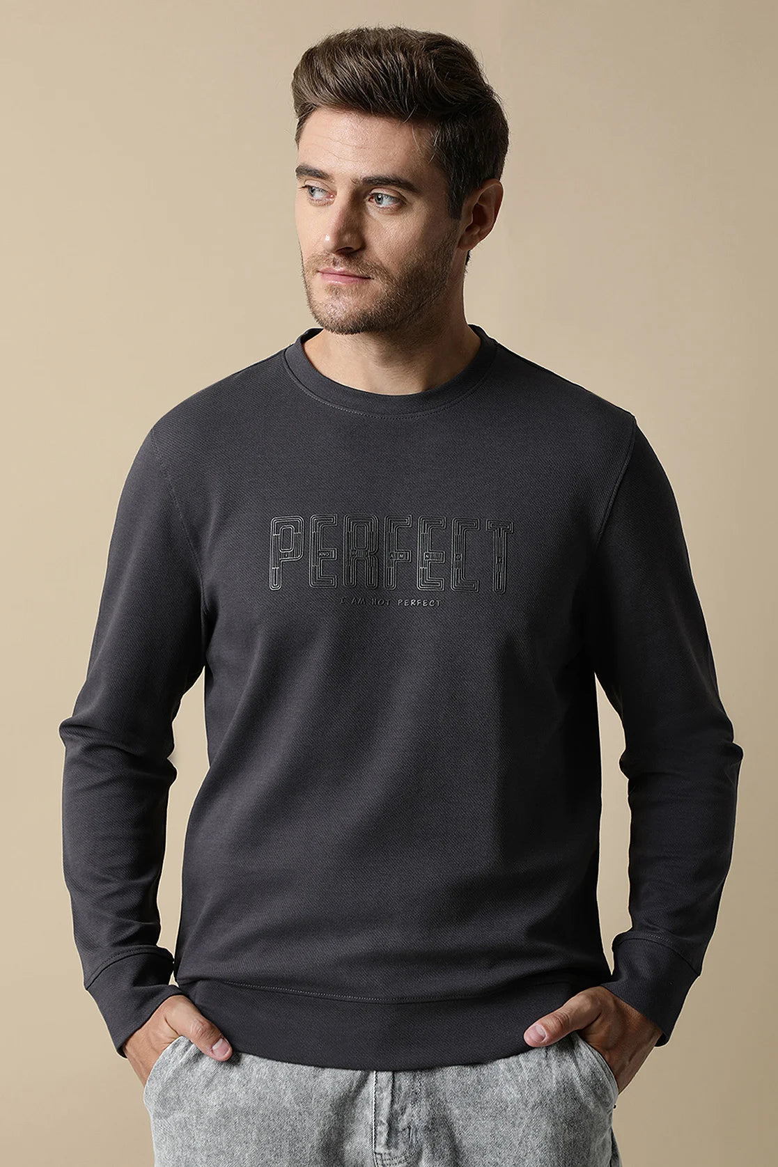 Shop online now for a stylish update to your wardrobe with the Men's Dark Grey Round Neck Sweatshirt featuring an embossed print on the chest, designed by Fort Collins. Available in India.