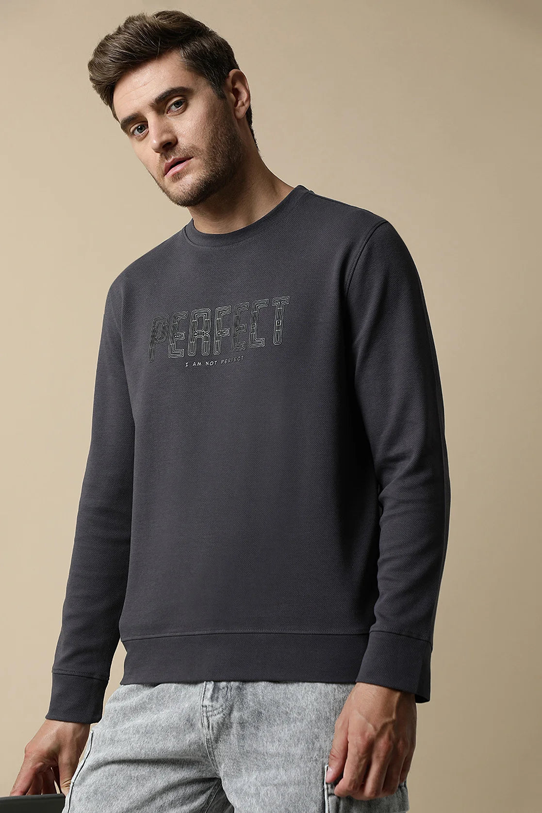 This Men's Dark Grey Round Neck Sweatshirt with Embossed Chest Print By Fort Collins is a must-have for every stylish wardrobe. Shop now to upgrade your fashion game, no matter where you are in India.