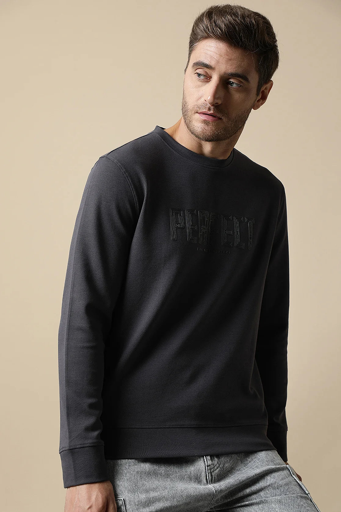 Effortlessly elevate your wardrobe with the Men's Dark Grey Round Neck Sweatshirt with Embossed Chest Print By Fort Collins. Whether shopping online or in India, this trendy sweatshirt is a must-have for any fashion-forward individual looking to upgrade their style game.