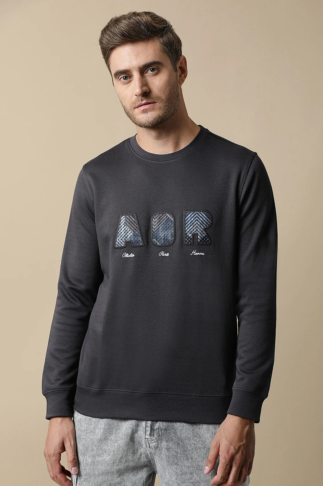 This expertly crafted Men's Dark Grey Sweatshirt by Fort Collins features an intricate embroidered chest design. Shop now for a stylish addition to your wardrobe, available for online purchase from anywhere in India.