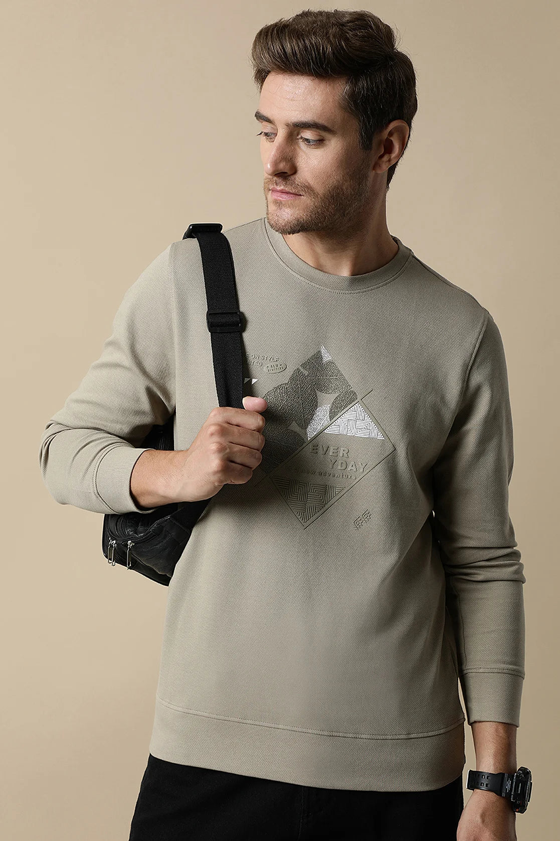 Upgrade your wardrobe with the Fort Collins Men's Fawn Round Neck Sweatshirt featuring an embossed graphic design. Made with durable diagonal interlock material, this sweatshirt is perfect for any occasion. Shop now to add this trendy piece to your collection, available for purchase from anywhere in India.