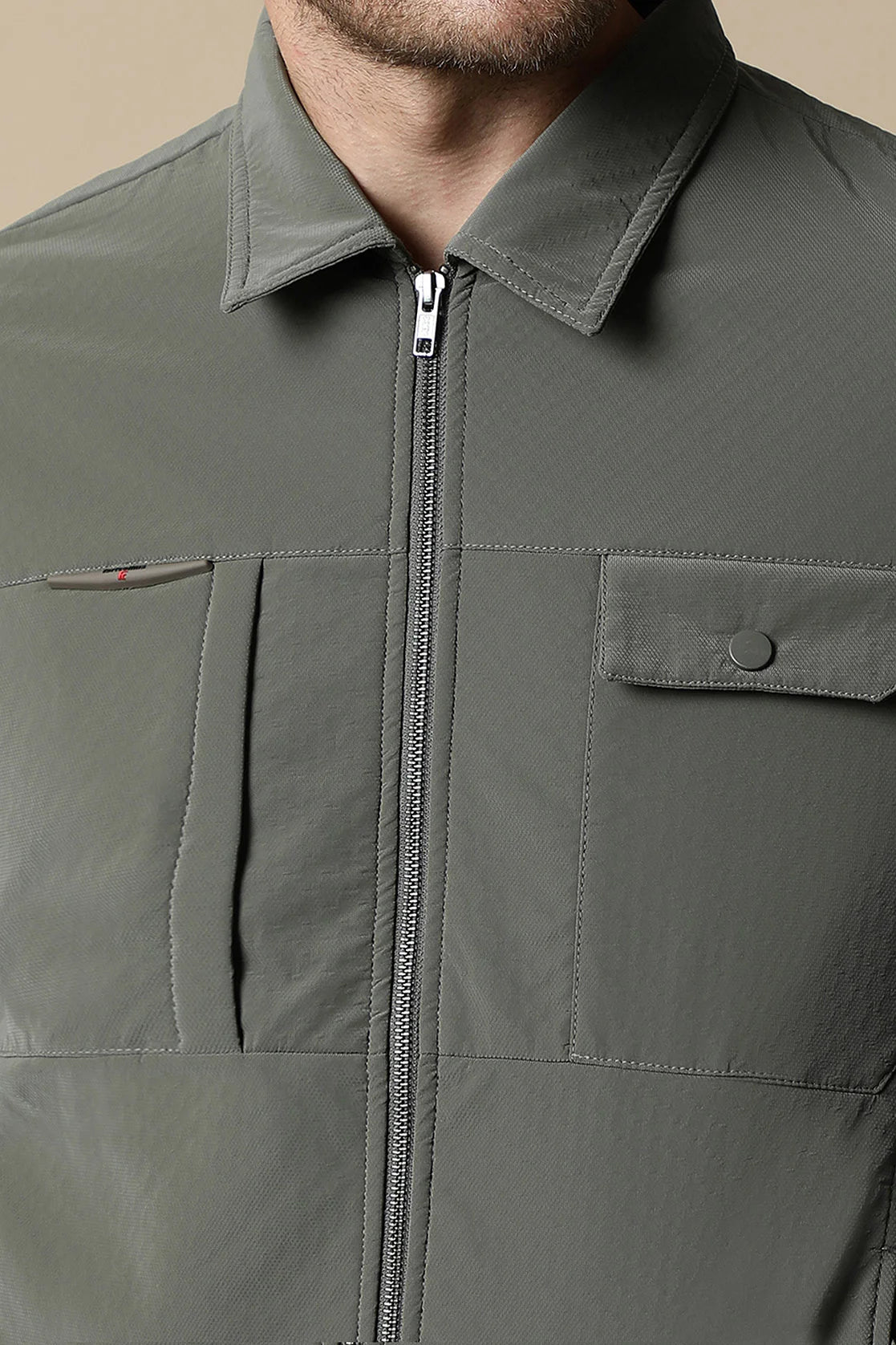 Upgrade your wardrobe with this Men's Olive Green PU Coated Jacket from Fort Collins. Featuring a classic front zip, it's a trendy choice for any occasion. Shop online now from anywhere in India.