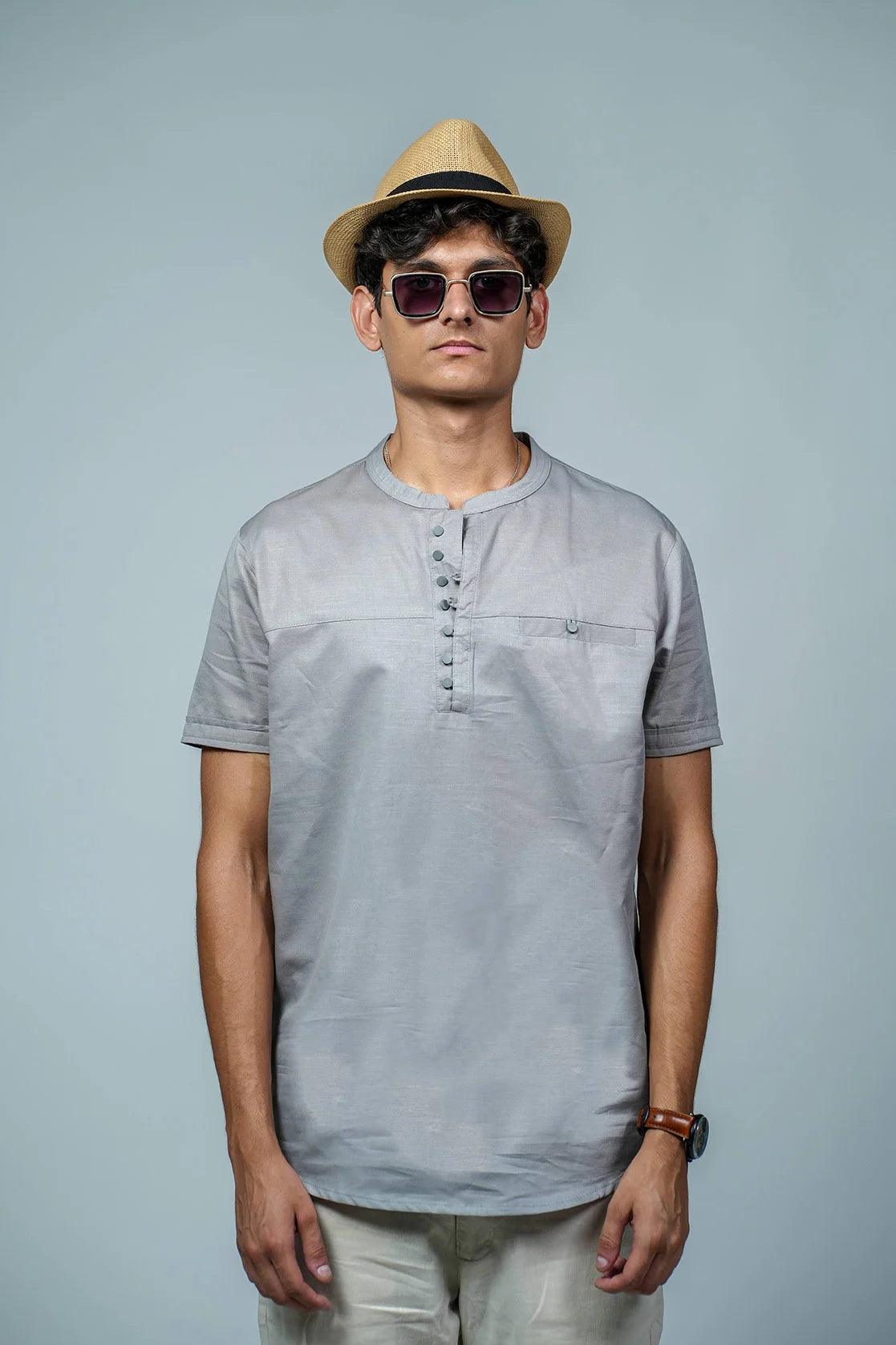 Experience ultimate comfort and sleek style with the Men's Grey Relaxed Fit Mandarin Collar T-Shirt Kurta, featuring a practical chest pocket. Expertly designed by Fort Collins.